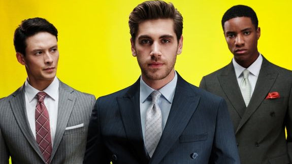 Three well-dressed men in suits.