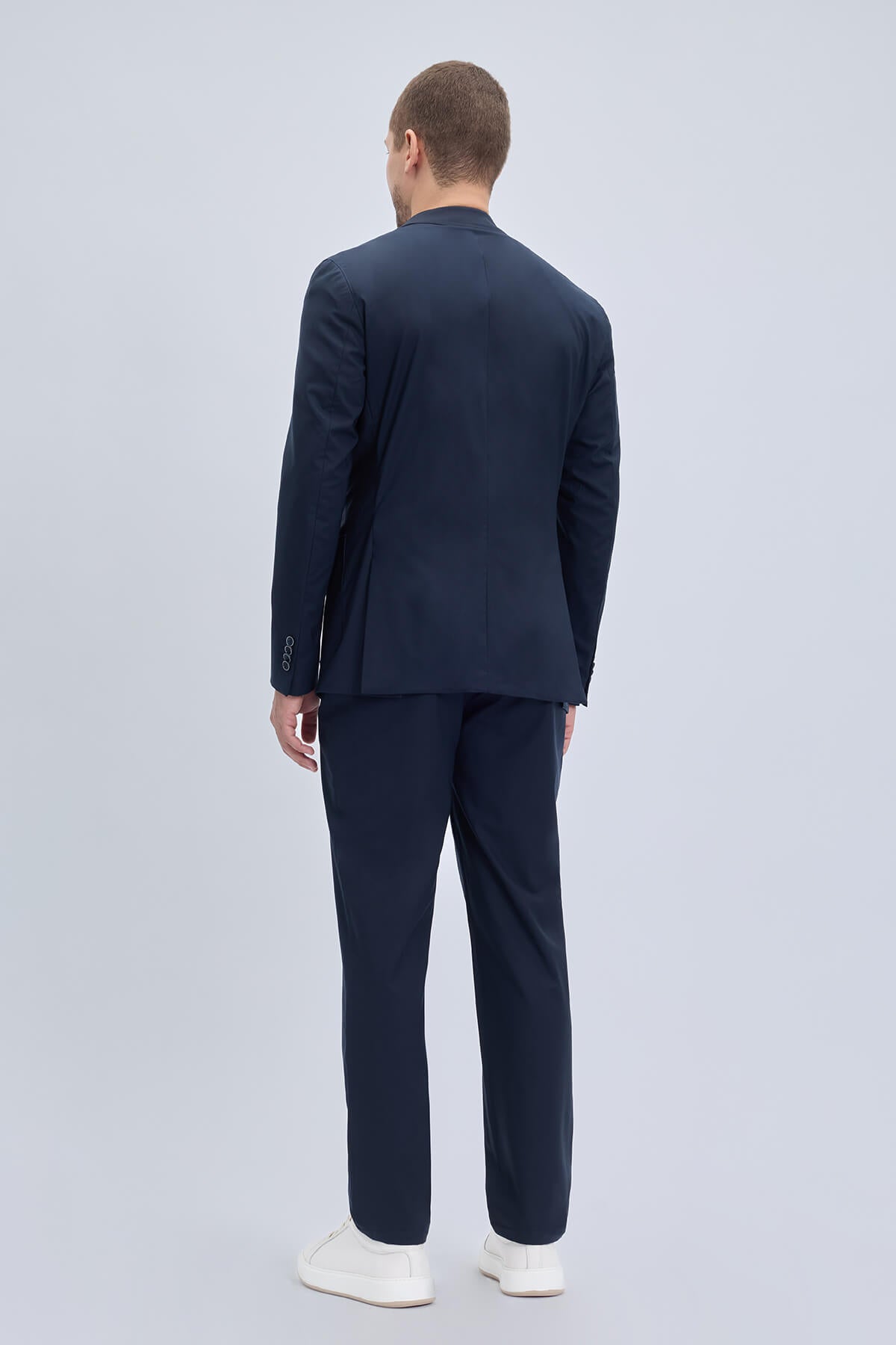 Navy blue slim fit notch lapel lightweight casual suit with sleek modern cut and subtle texture