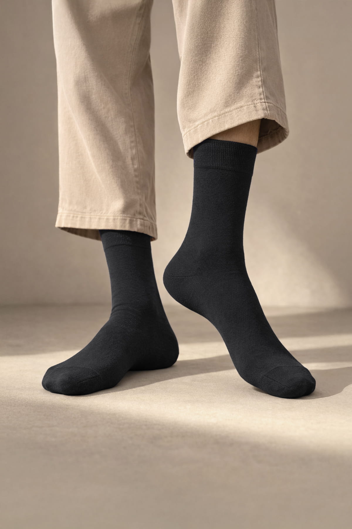 Black crew-length bamboo dress socks with ribbed cuff made of soft cotton blend in a 4-pack socks set