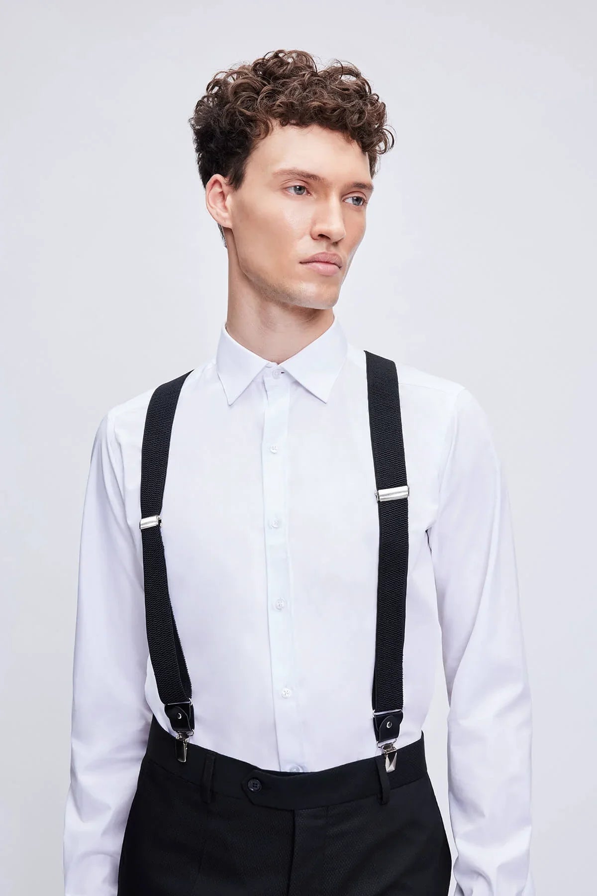 Black leather trim clip suspenders with black straps and silver-toned metal clasps and adjustable buckles