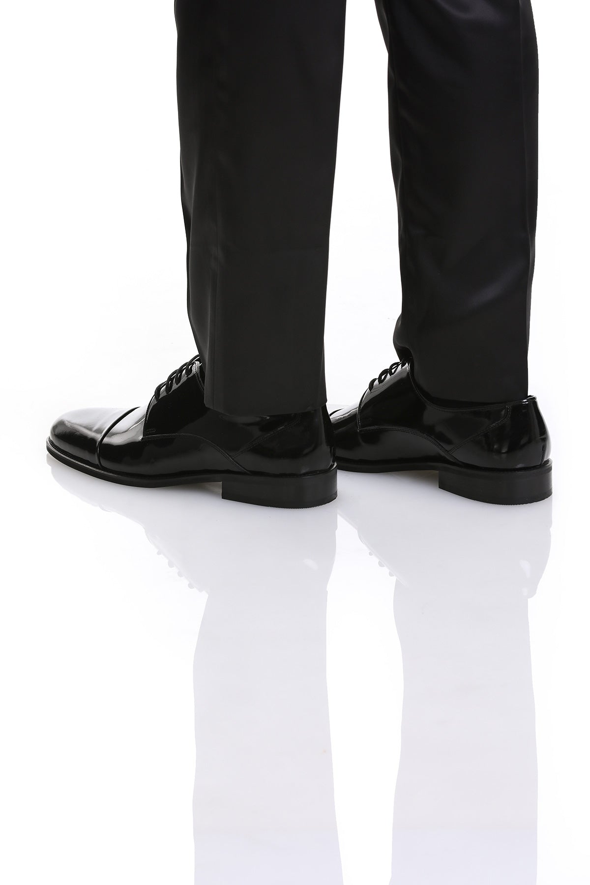 Black patent leather dress shoes with a polished finish and classic lace-up design.