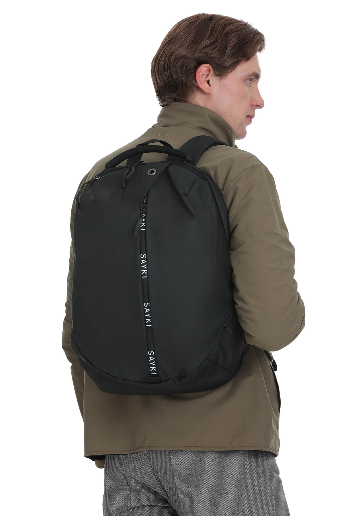 Black sakki backpack with a sleek, modern design and vertical branding along the zipper pull.