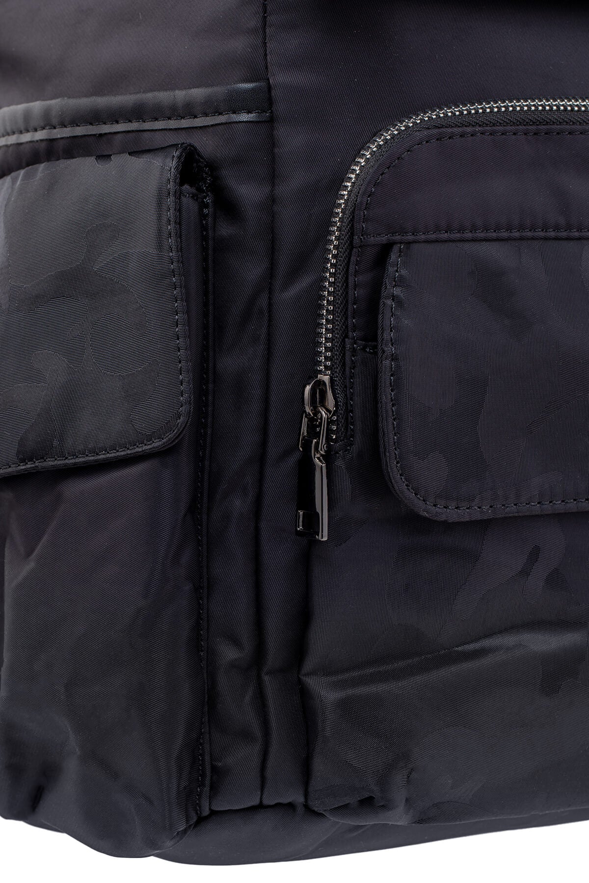 Black nylon backpack with subtle camouflage pattern and silver zipper pulls.