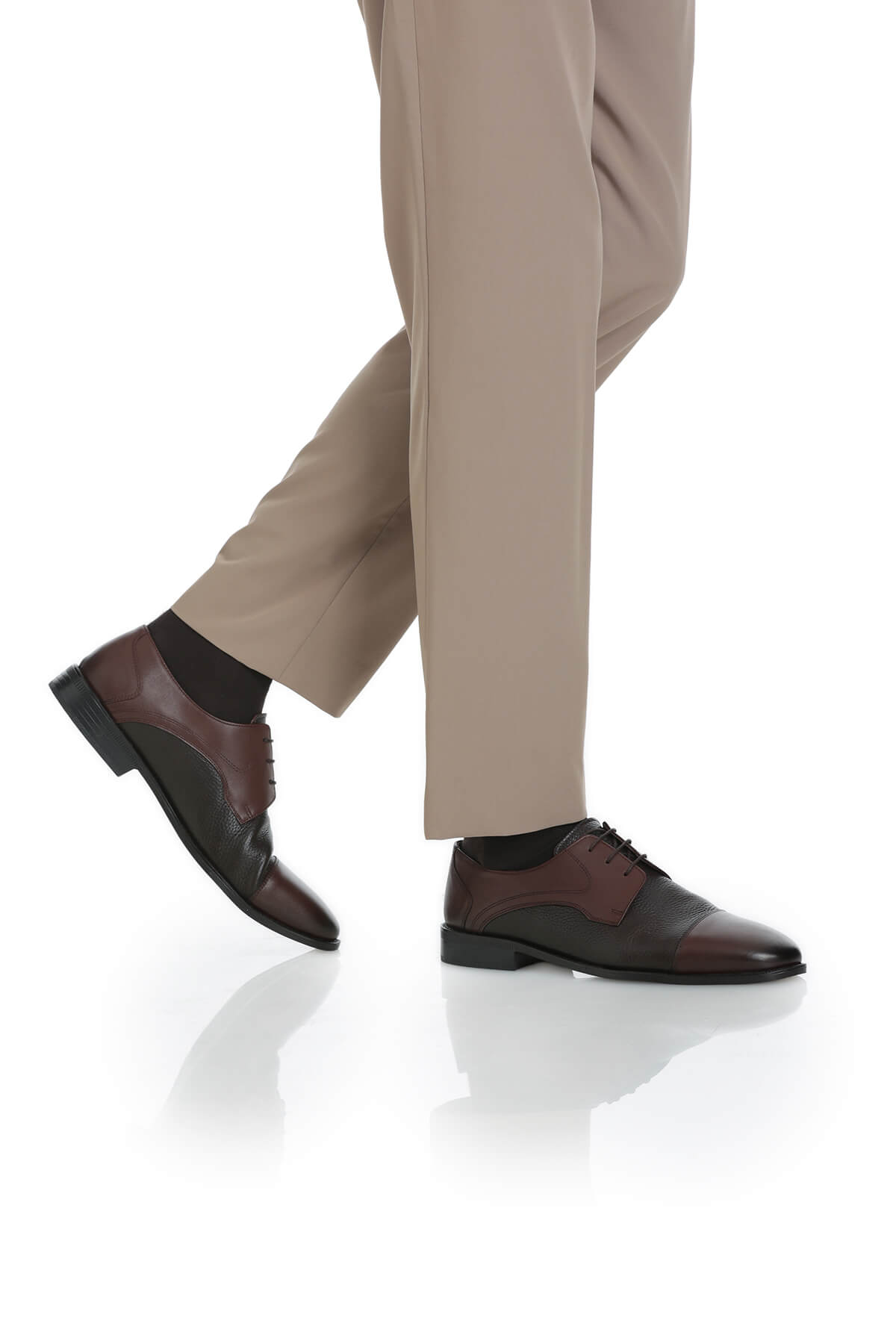 Brown and black two-tone leather dress shoes with a classic oxford design.