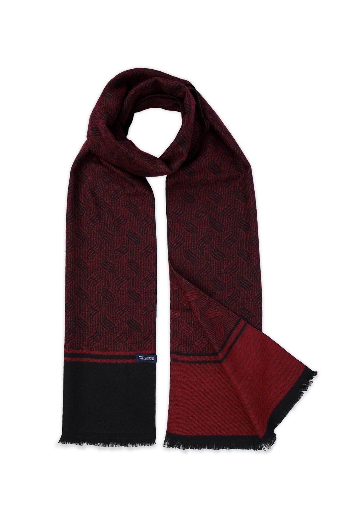 A rich burgundy scarf with a subtle geometric pattern, featuring black fringed edges and contrasting navy blue trim at the ends.