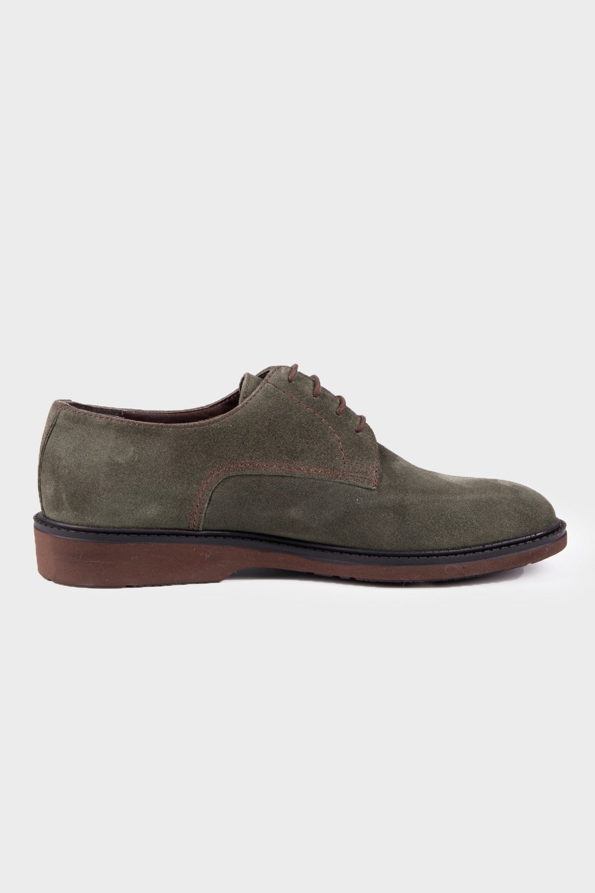 Olive green suede lace-up oxford shoe with a brown rubber sole.