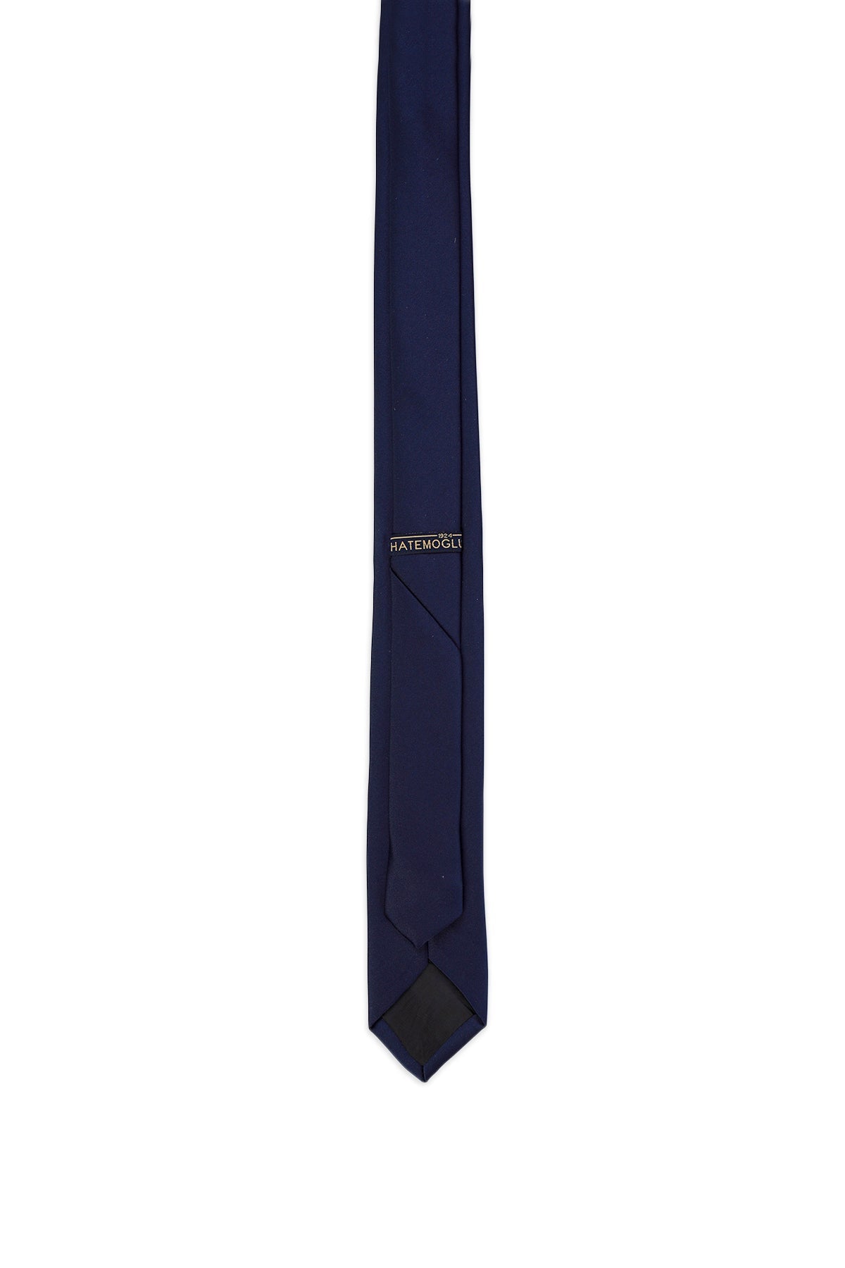 A sleek navy blue silk tie with a subtle sheen and the brand name ’ratémôlè’ embroidered in gold thread near the top.