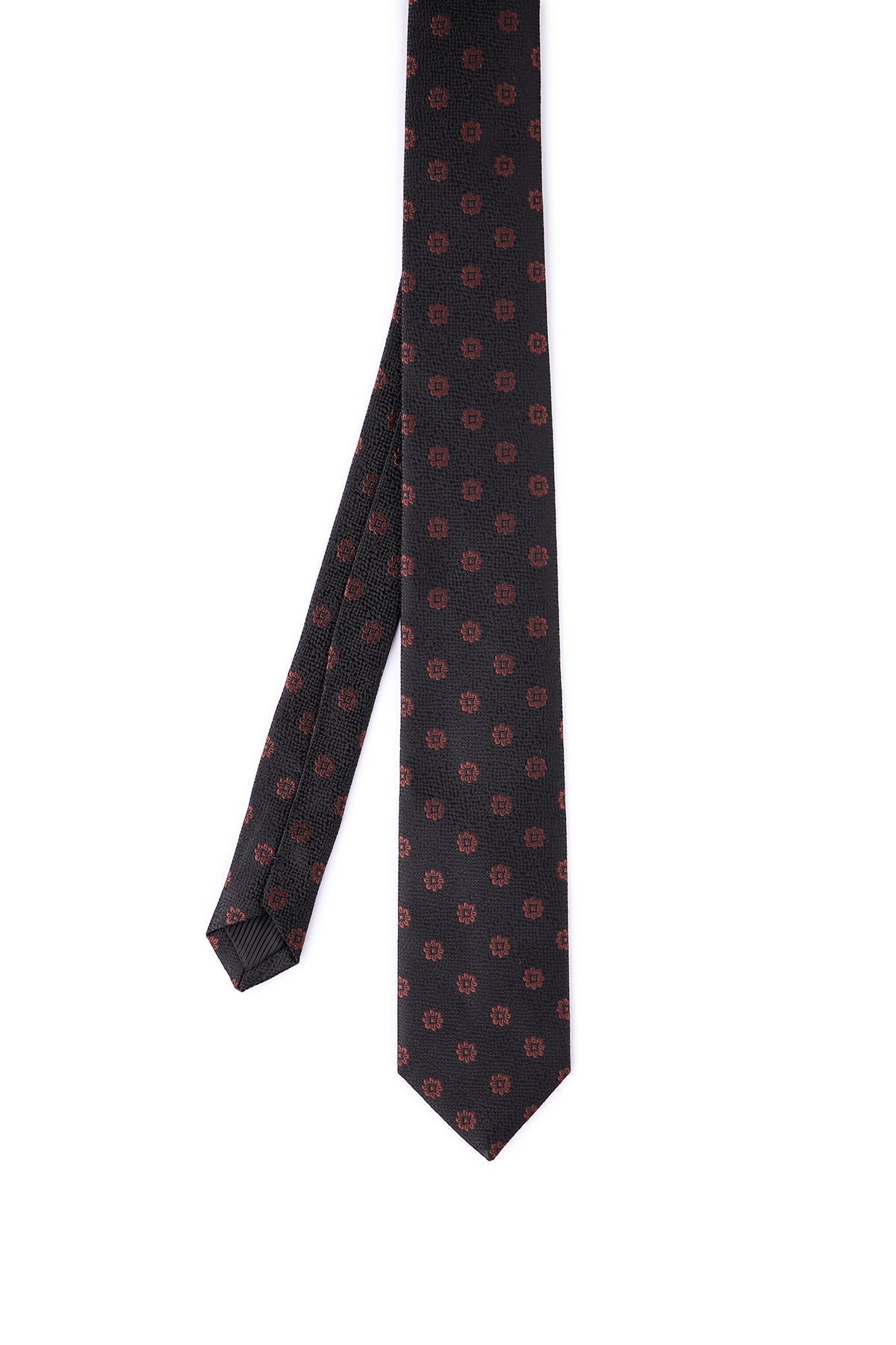 A dark gray tie with a subtle, repeating pattern of small red geometric shapes.