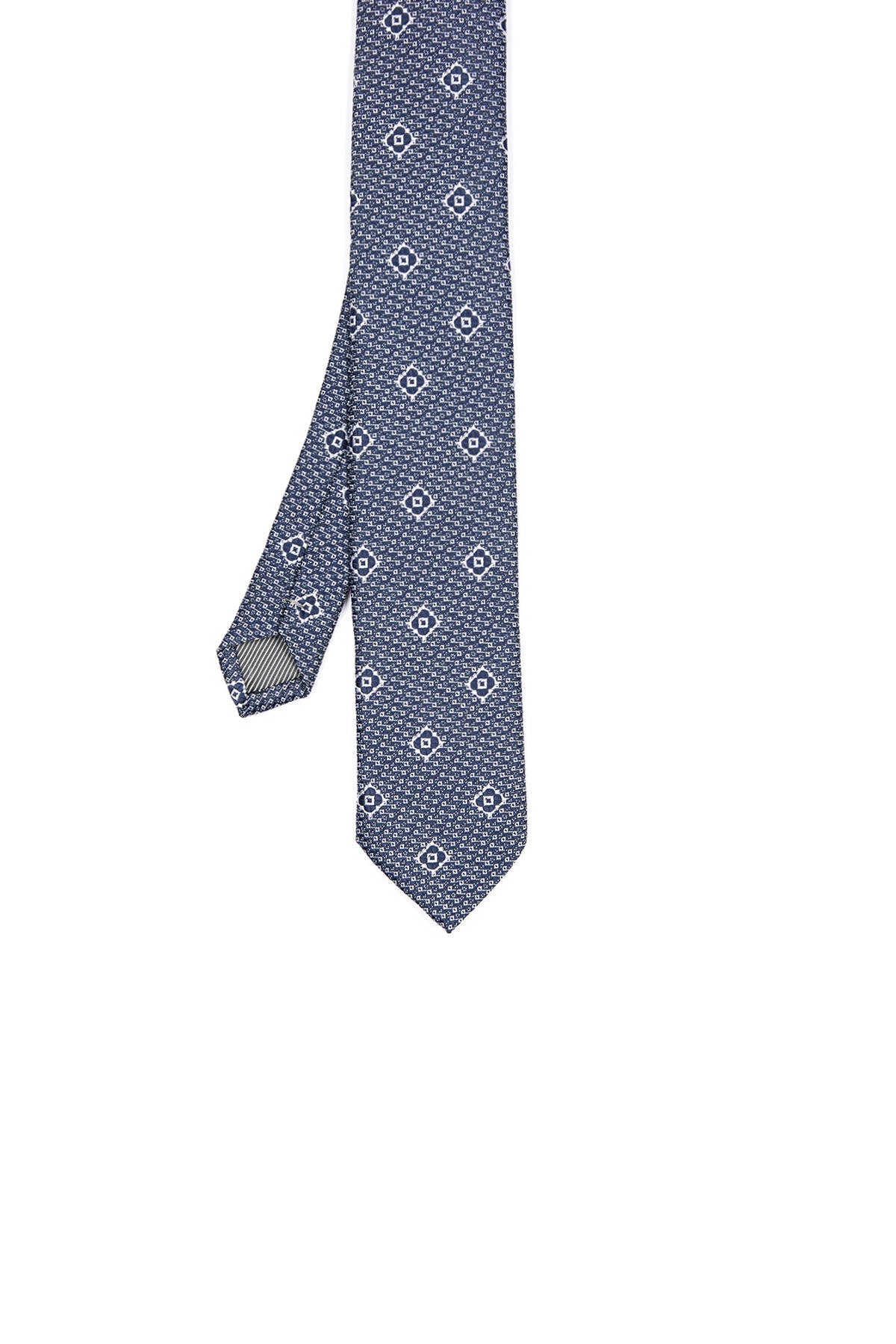A navy blue silk tie featuring a subtle geometric pattern of white diamond-shaped motifs.