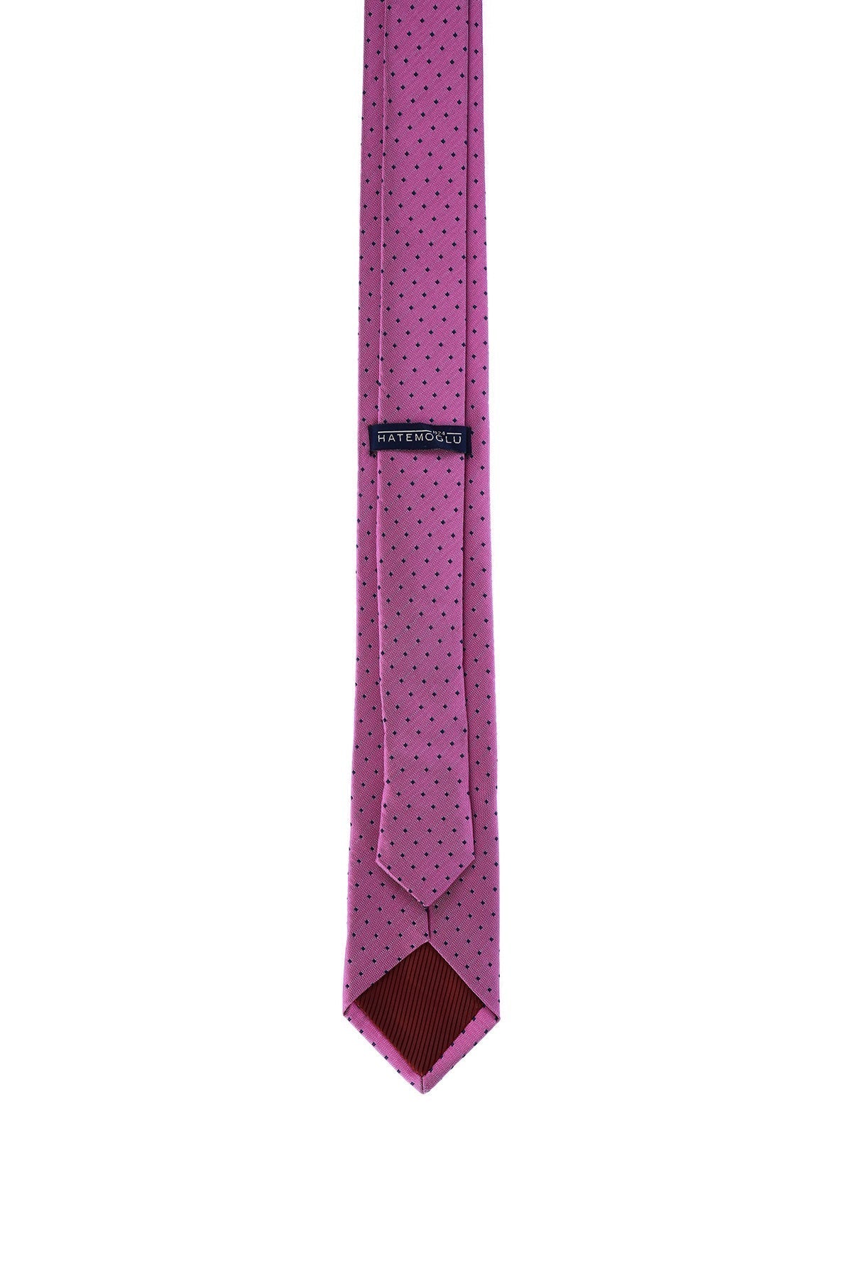 A vibrant magenta tie with a subtle pattern of dark dots, featuring a branded label and a contrasting brown inner lining.