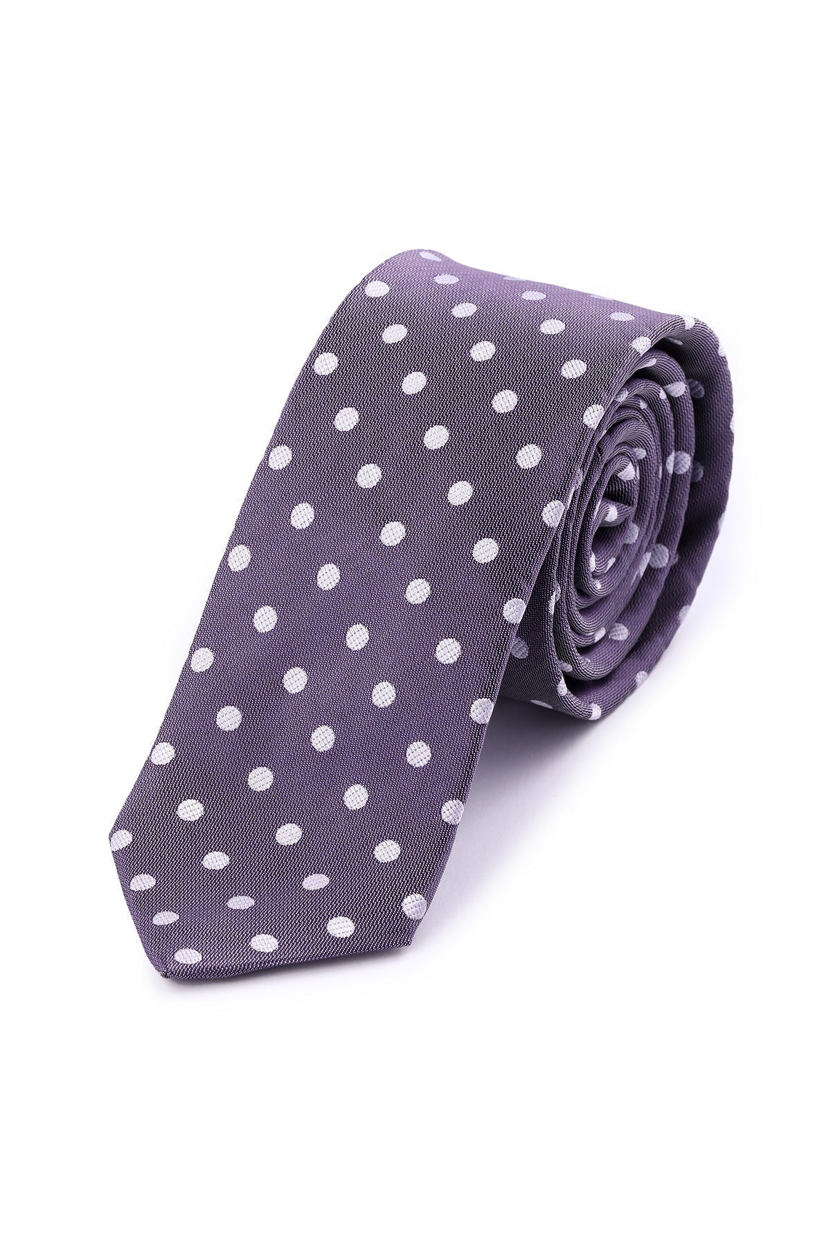 A neatly rolled dark gray tie with evenly spaced white polka dots.