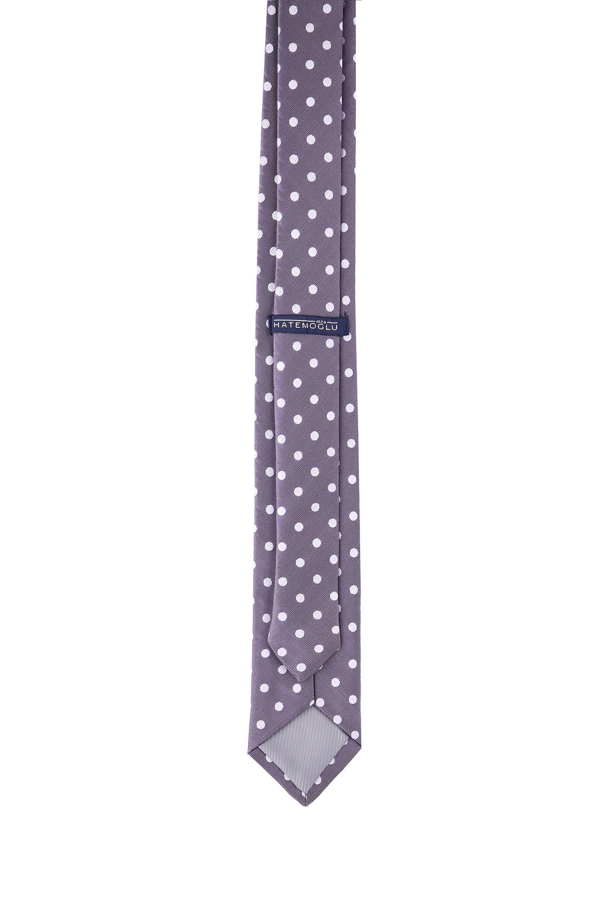 A sleek gray tie adorned with evenly spaced white polka dots, featuring a subtle woven texture and a branded label near the top.