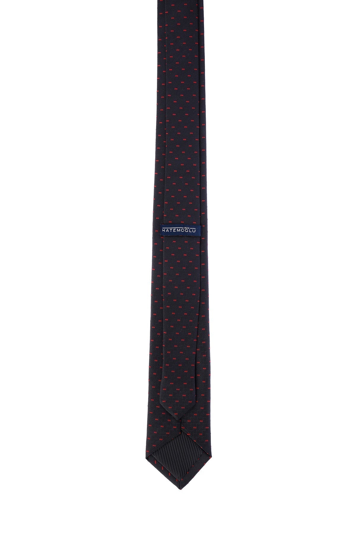 A dark navy tie with a subtle pattern of fine red dots, featuring a neatly stitched pointed tip and a branded label near the top.