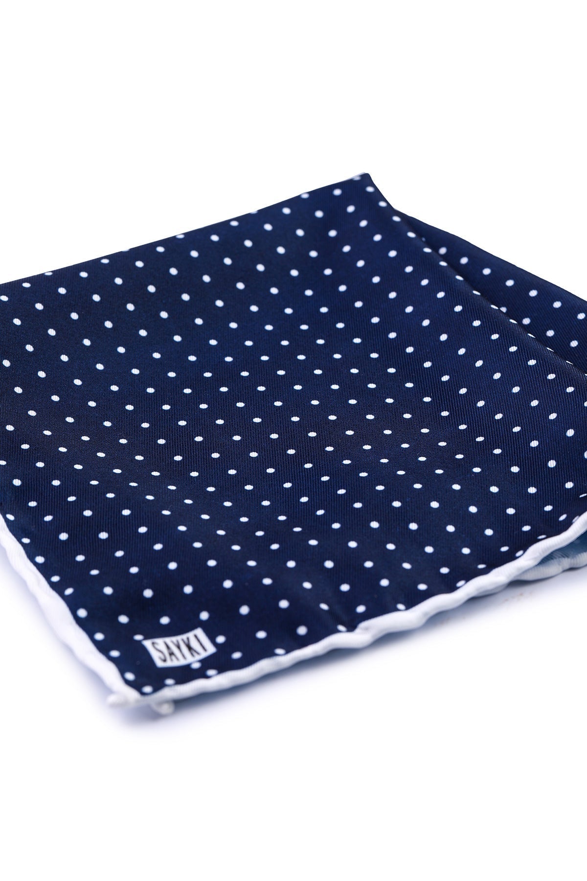 Navy blue pocket square with white polka dots and a scalloped edge trim