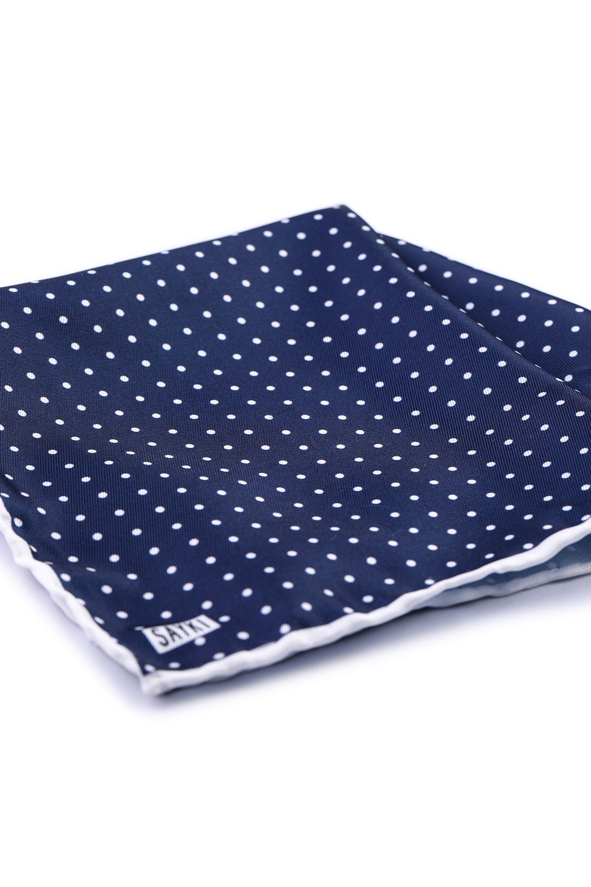 Navy blue pocket square with white polka dots and a contrasting white scalloped edge
