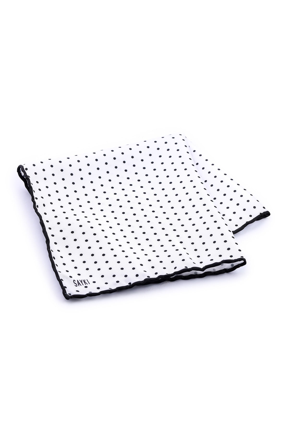 White pocket square with black polka dots and a matching black border, featuring the brand name ’sayki’ embroidered in small letters.