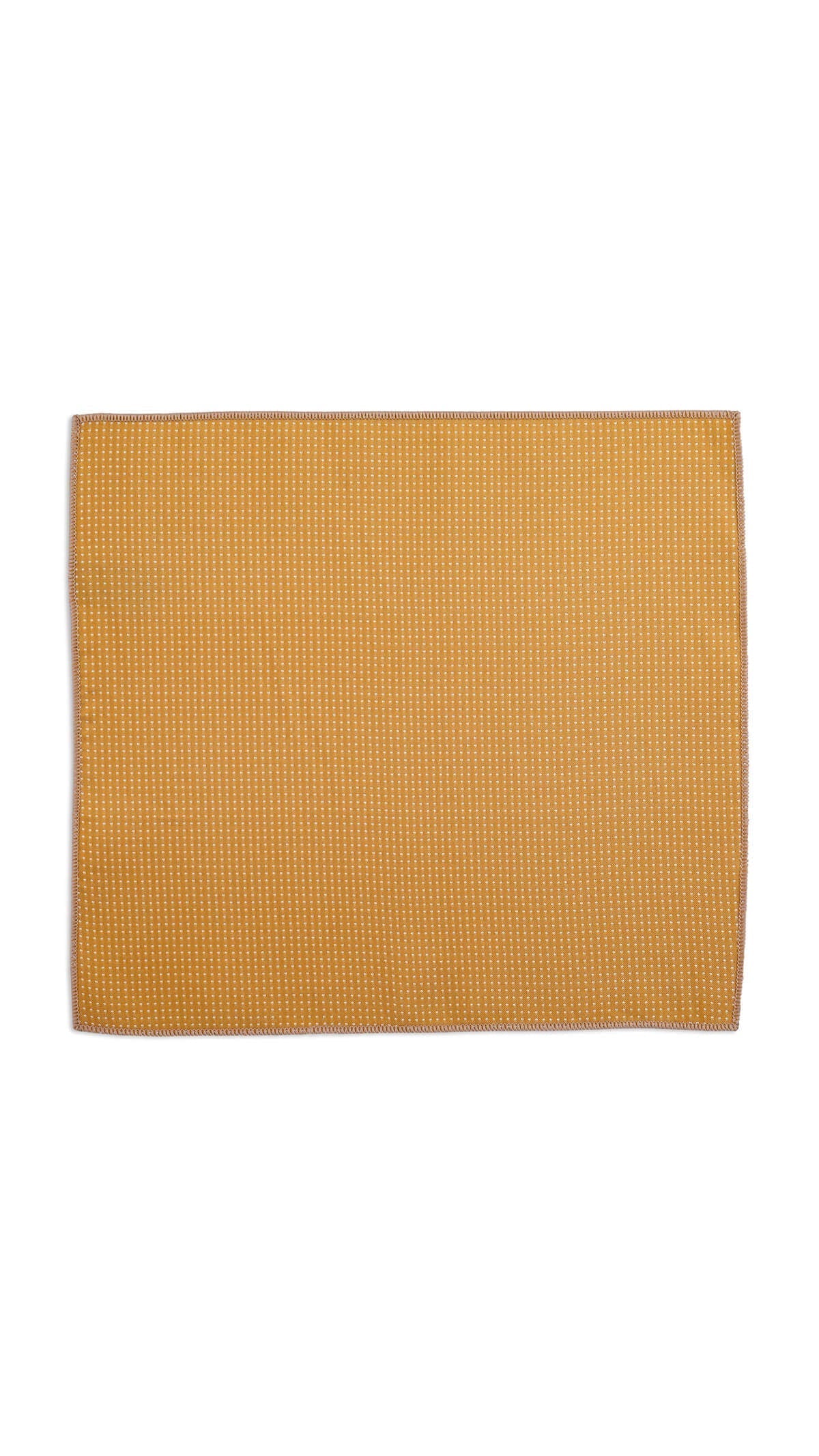 A mustard-yellow woven placemat with a subtle textured pattern.