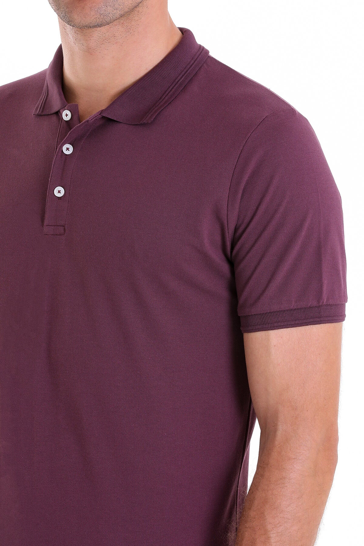 A men’s maroon polo shirt with a ribbed collar and sleeve cuffs, featuring white buttons.