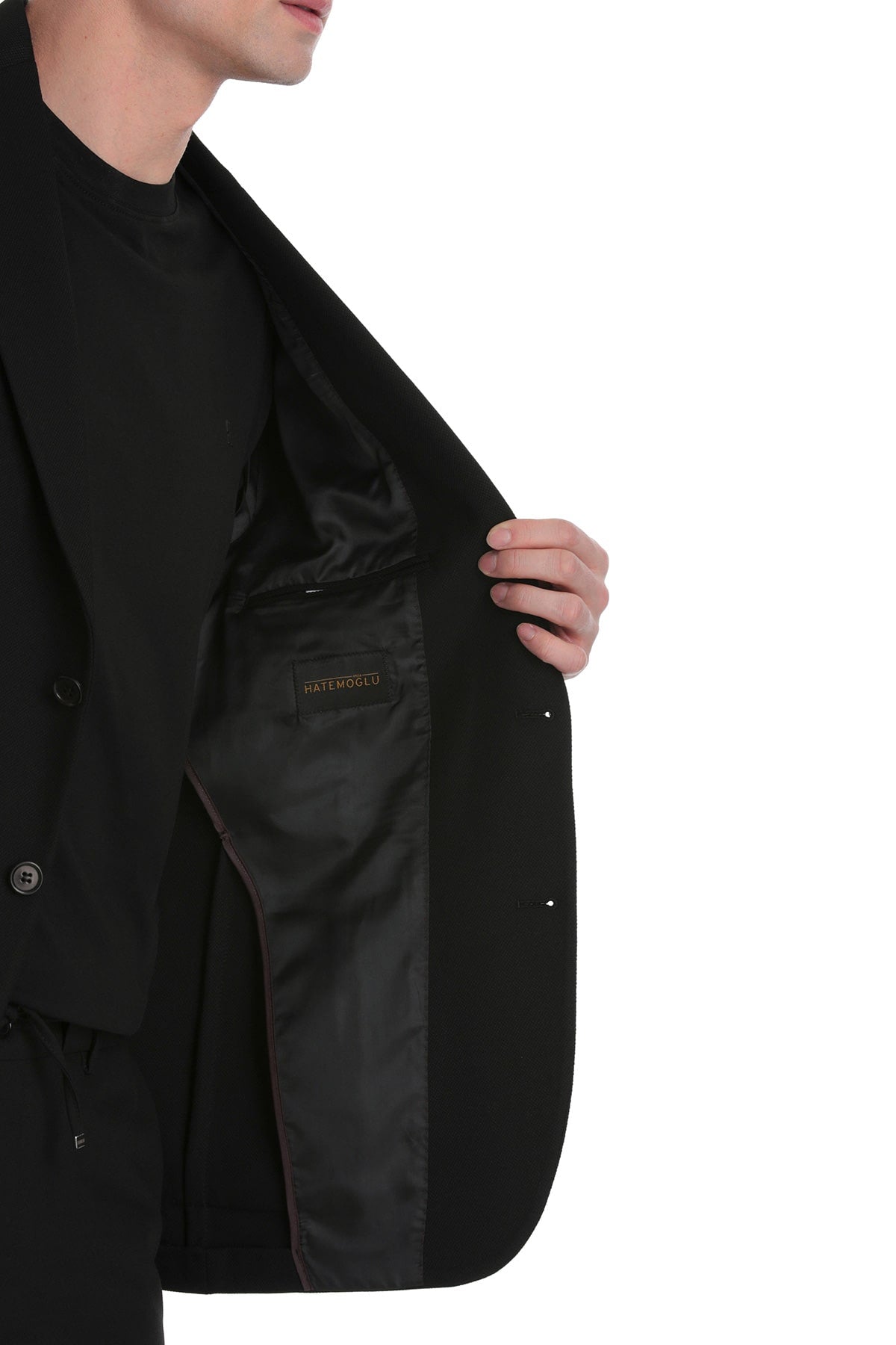 Black tailored blazer with a sleek, structured design and subtle satin lining.