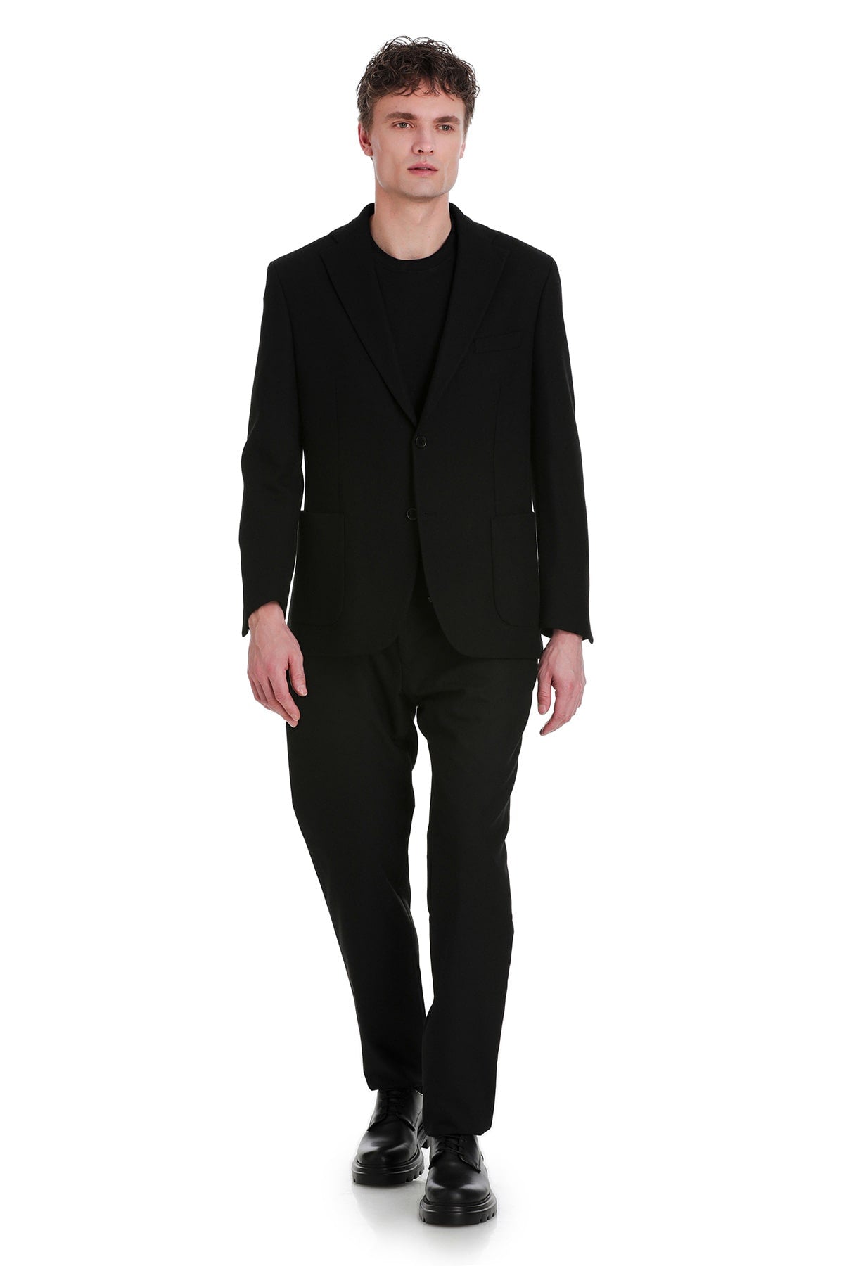 Black tailored suit with a sleek, modern cut.