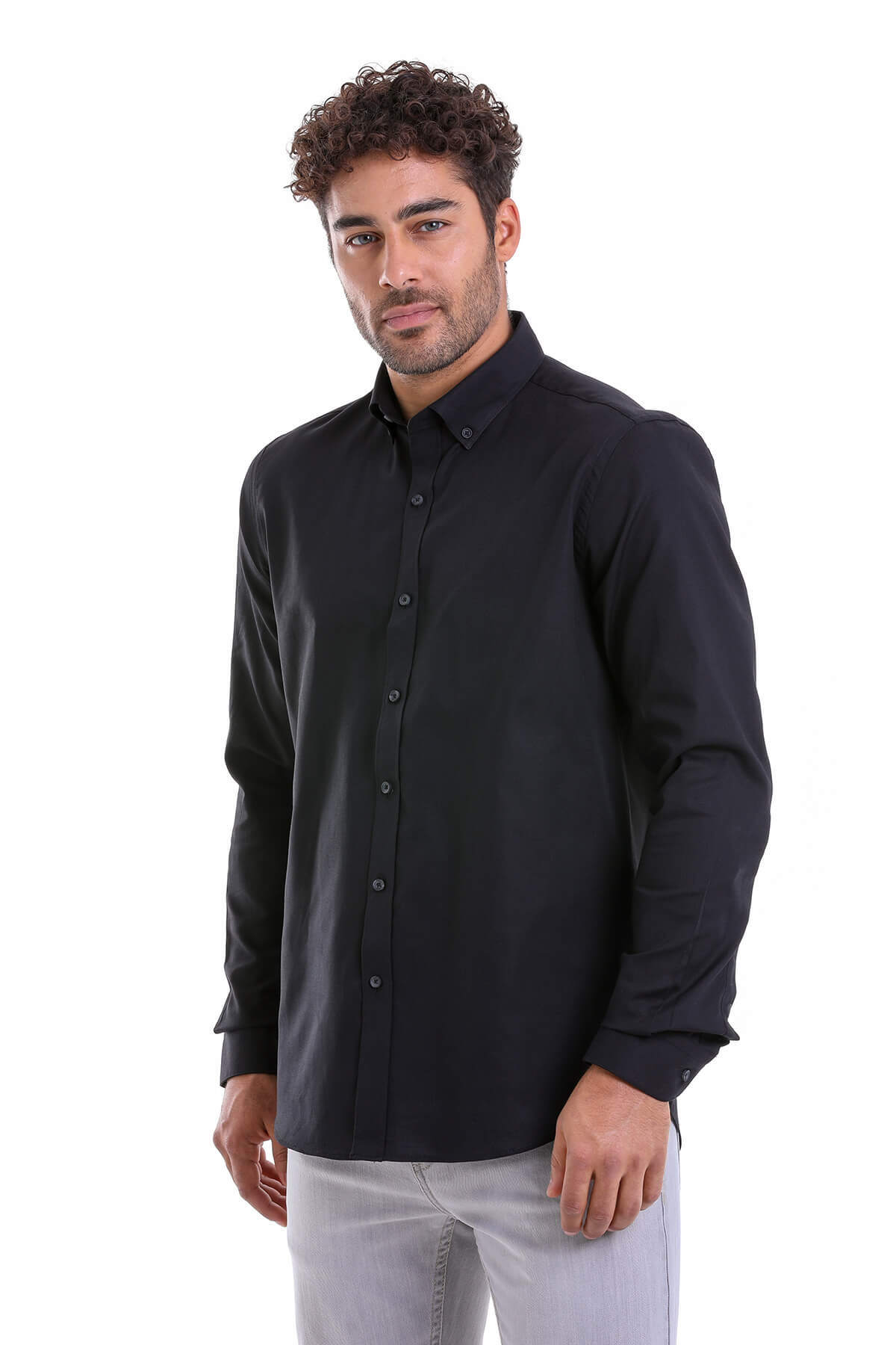 Black long-sleeved button-down shirt with a classic collar and neatly pressed fabric.