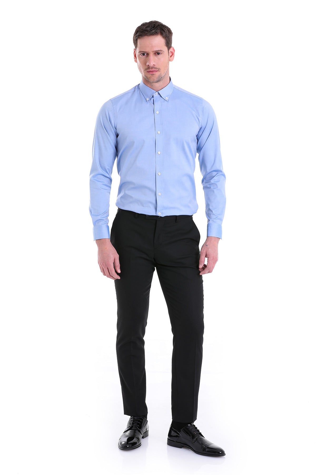 A light blue, long-sleeved men’s dress shirt with a classic collar and button-down front.