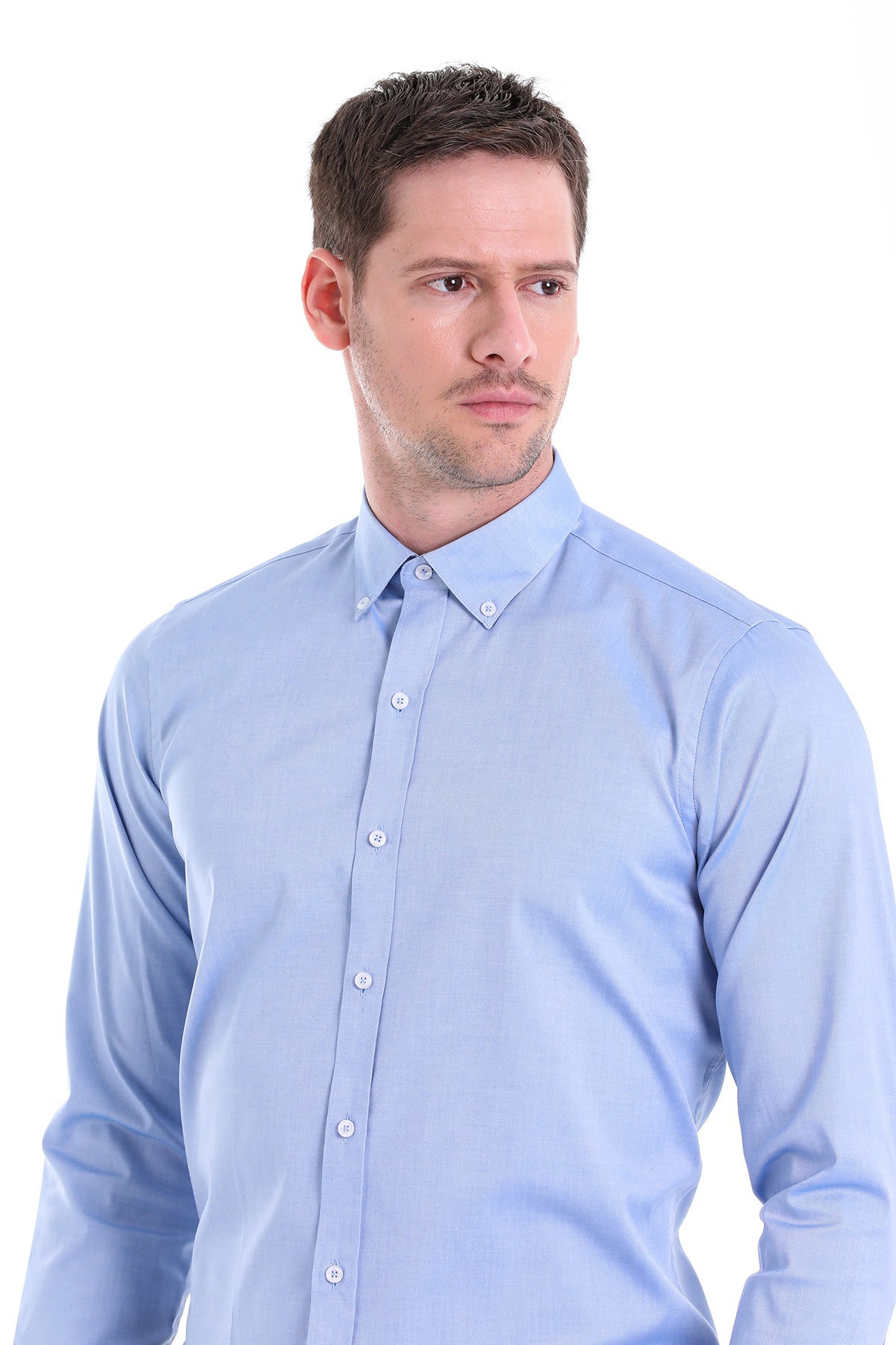 Light blue long-sleeved button-down shirt with a classic collar and matching buttons.