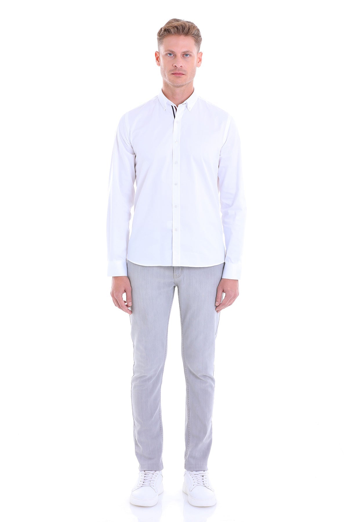 A crisp white long-sleeved button-up shirt with a classic collar and neat stitching.