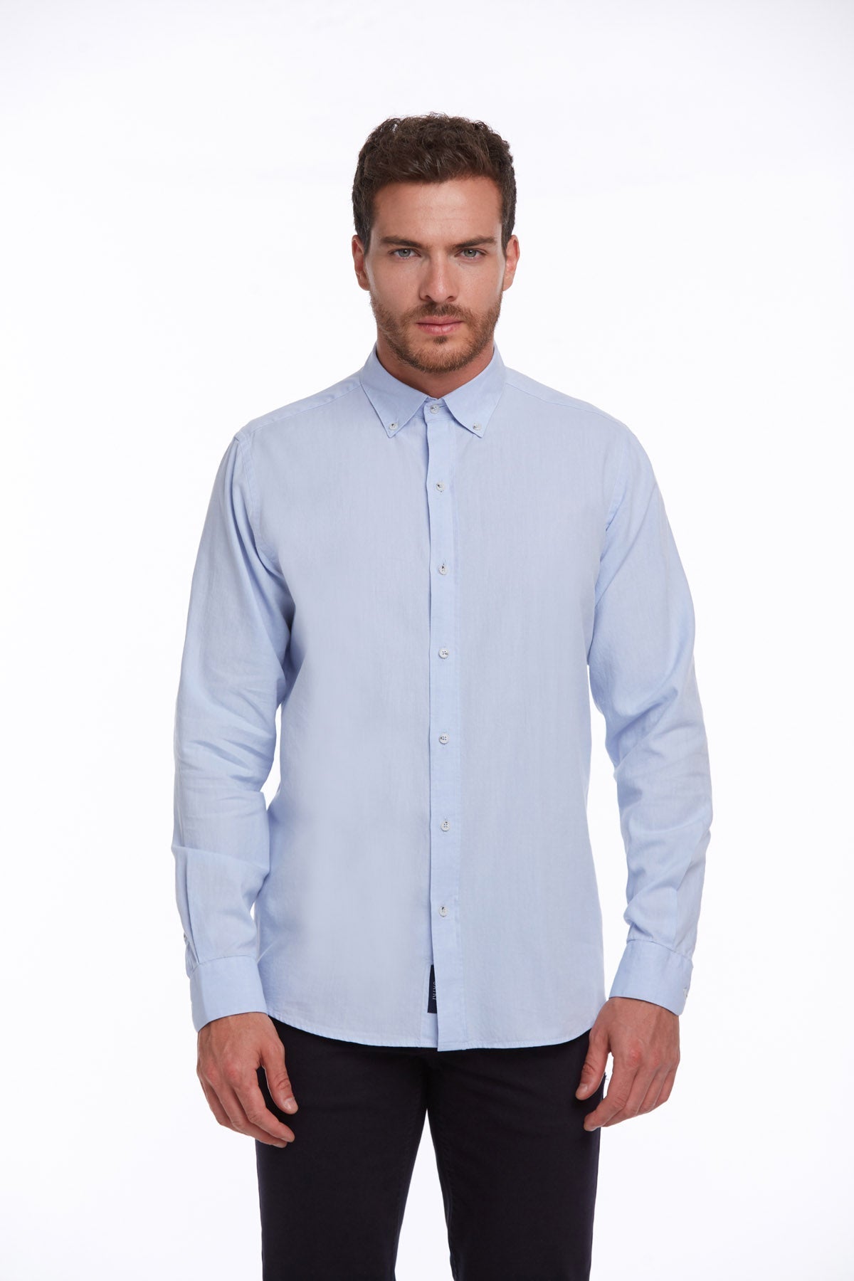 Light blue, long-sleeved men’s dress shirt with a classic button-down collar and neatly pressed fabric.