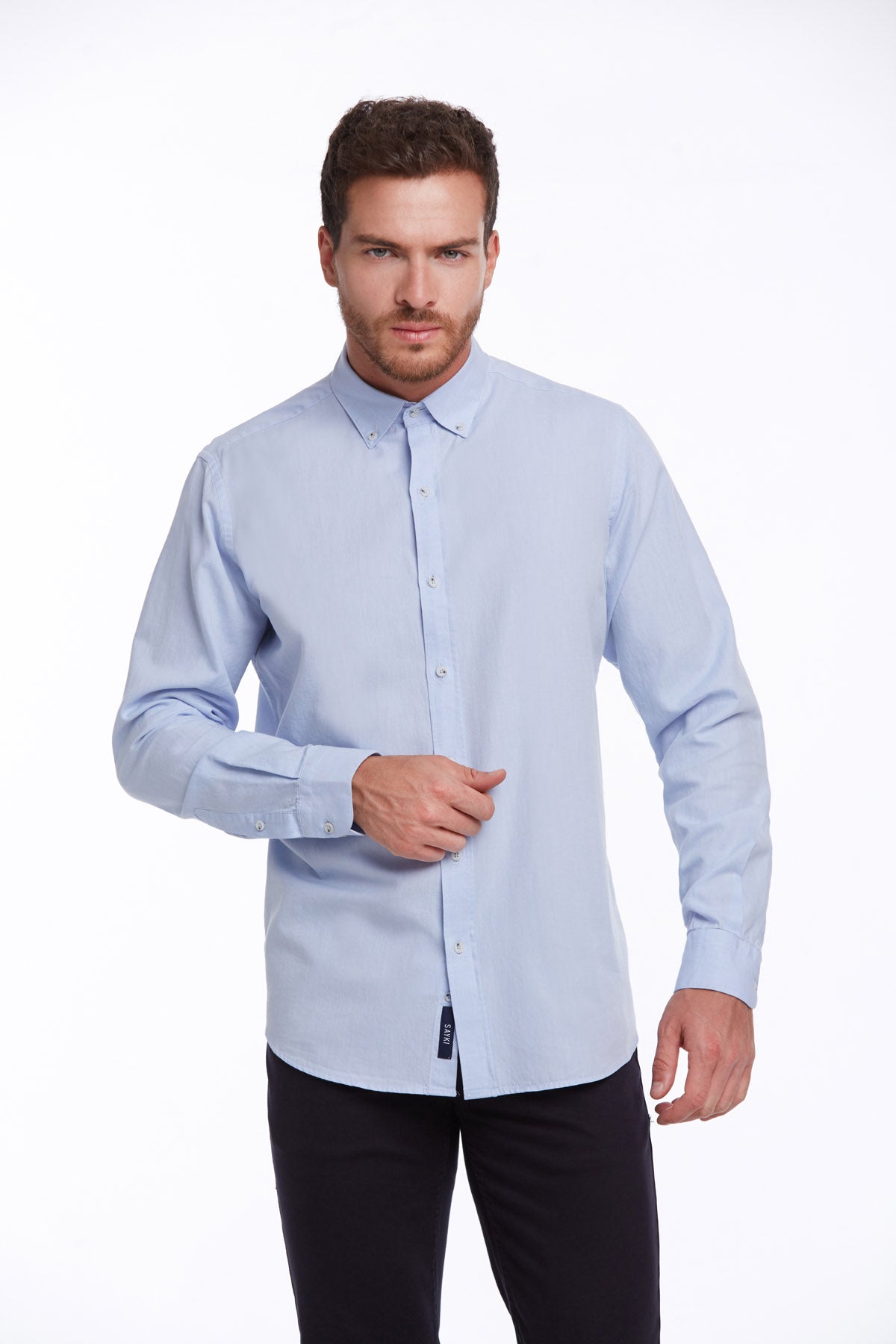 Light blue long-sleeved button-down shirt with a classic collar and subtle texture.