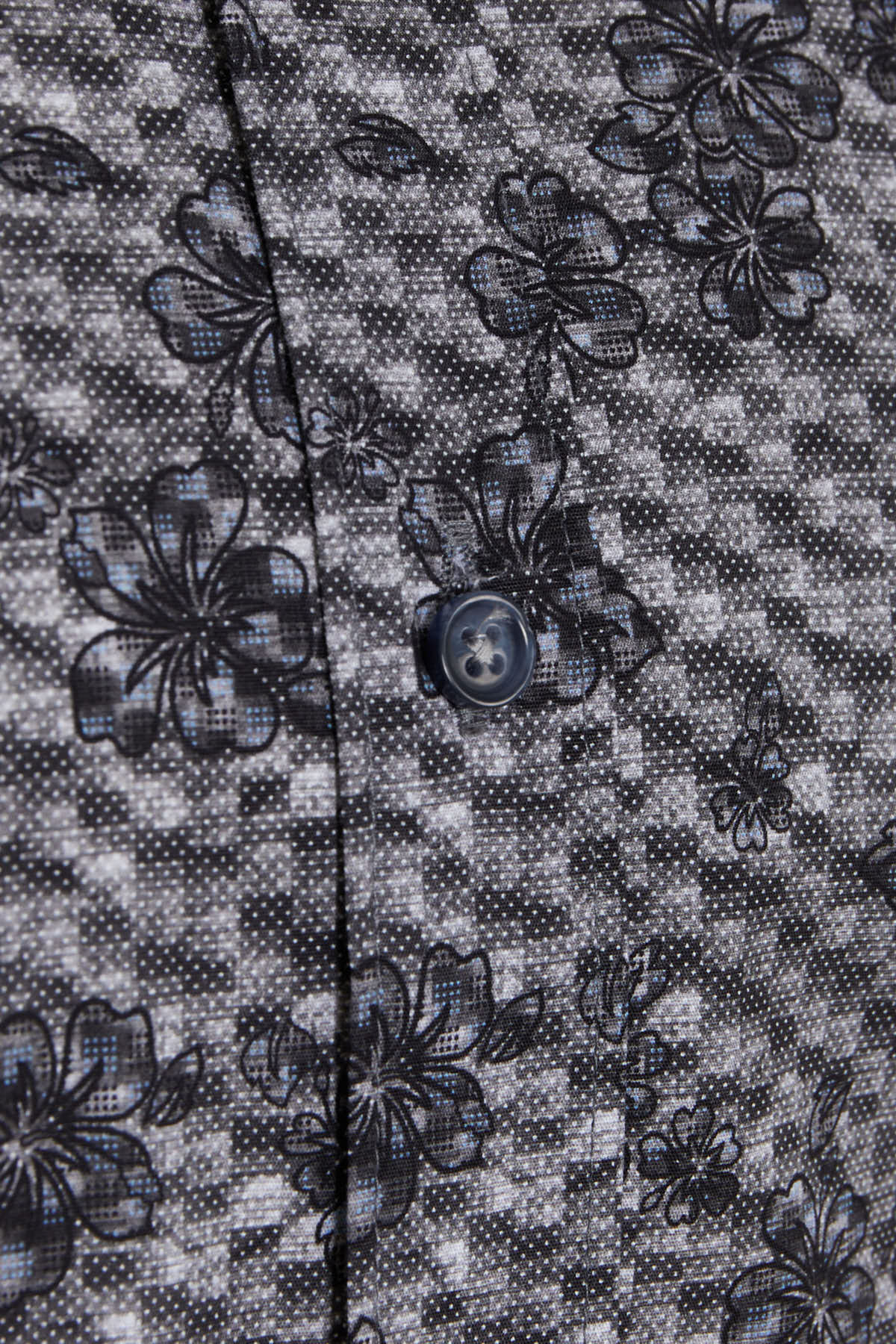 Black floral-patterned shirt with a subtle checkered background and dark gray buttons.