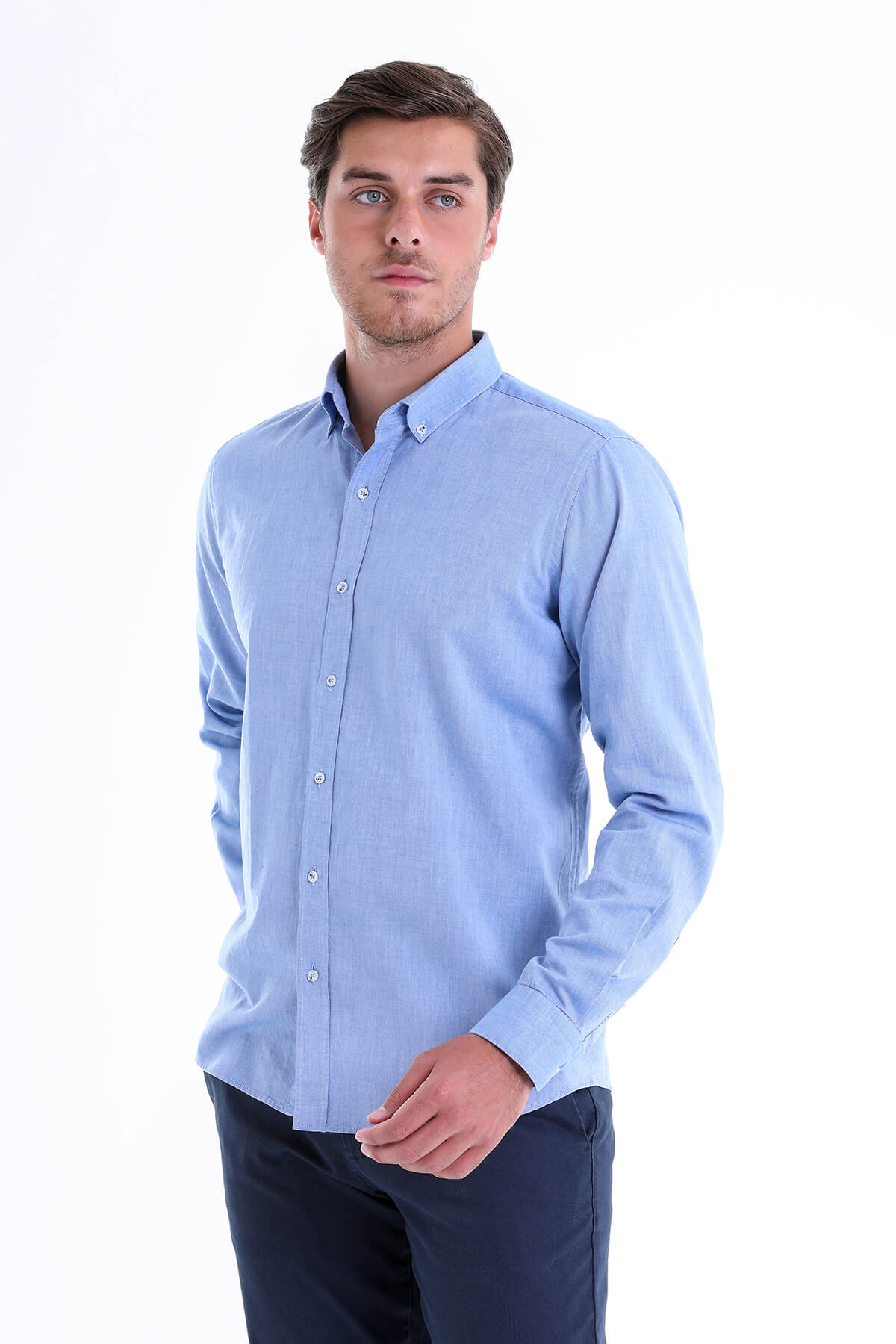 A light blue, long-sleeved button-down shirt with a classic collar and neatly pressed fabric.