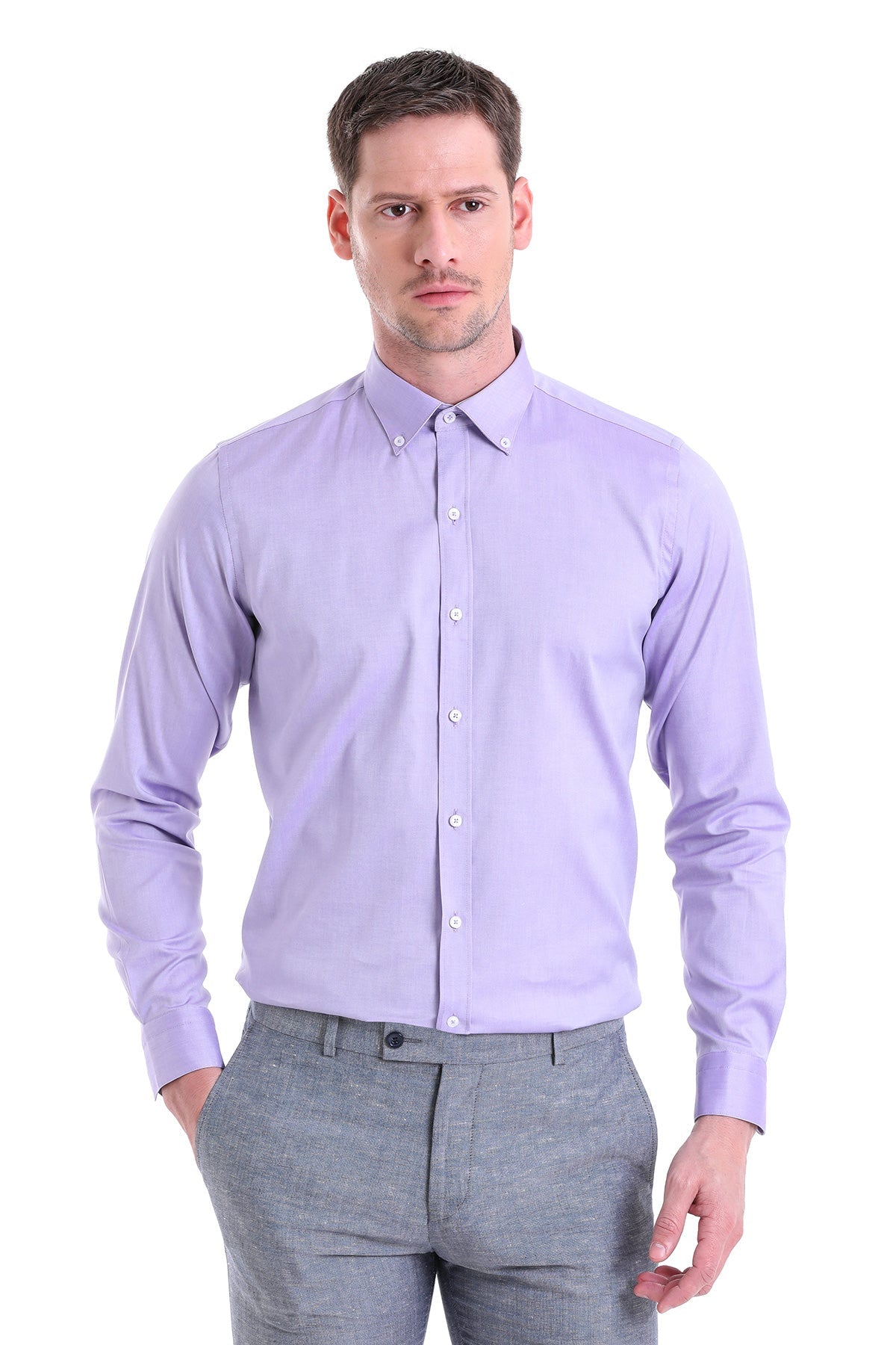 A man wearing a lavender long-sleeved button-down shirt with a classic collar and white buttons.
