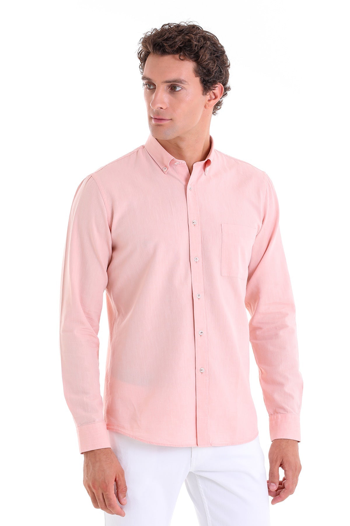 A soft pink, long-sleeved button-down shirt with a classic collar and subtle chest pocket.