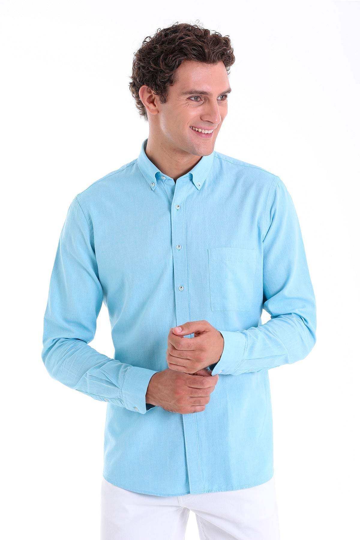 Light blue long-sleeved button-down shirt with a classic collar and chest pocket.