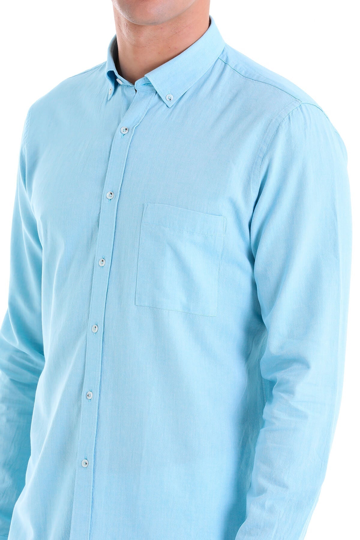 Light blue long-sleeved button-down shirt with a chest pocket and matching buttons.