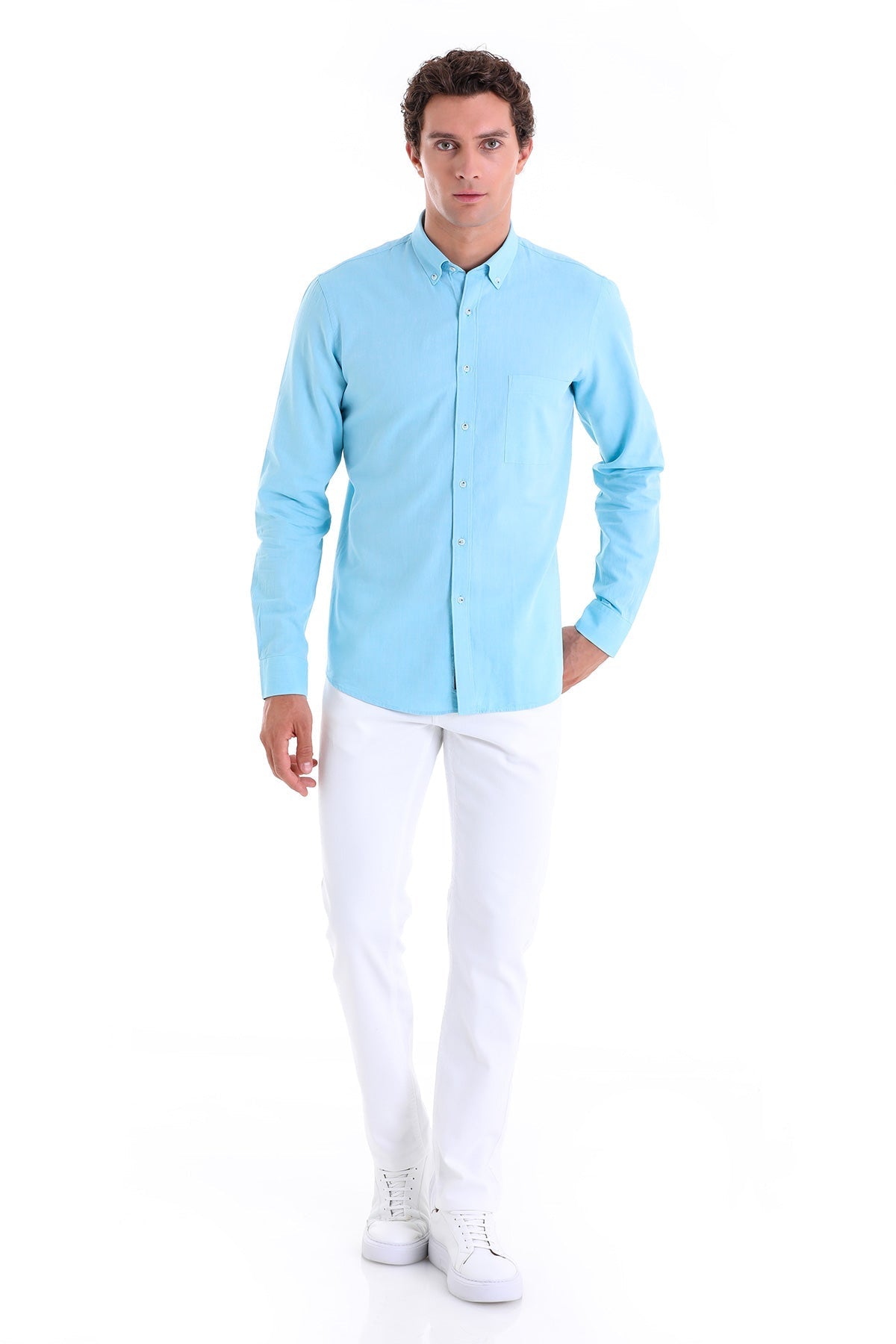 A light blue, long-sleeved button-down shirt with a classic collar and single chest pocket.