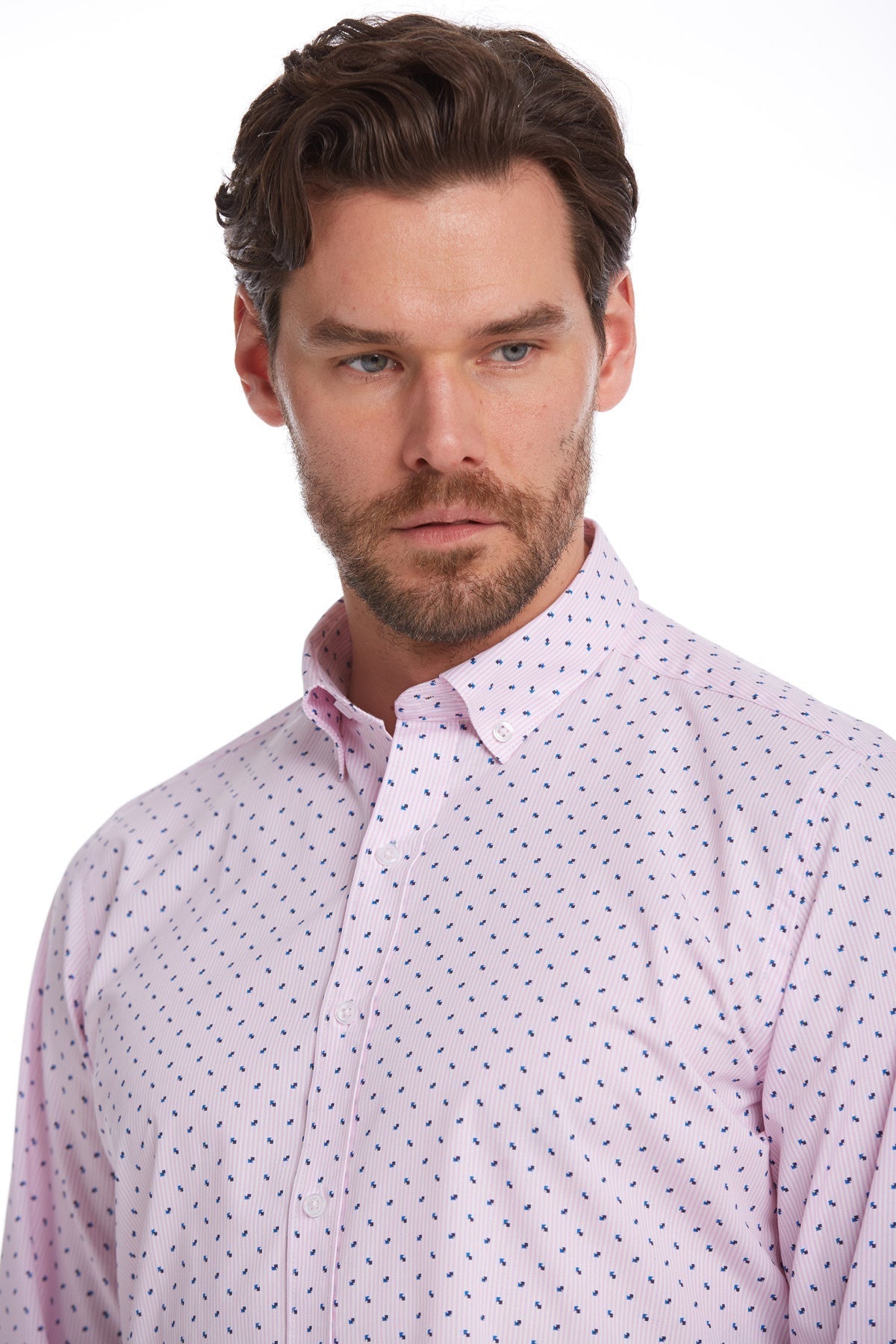 A light pink button-down shirt with a subtle pattern of small dark blue dots.