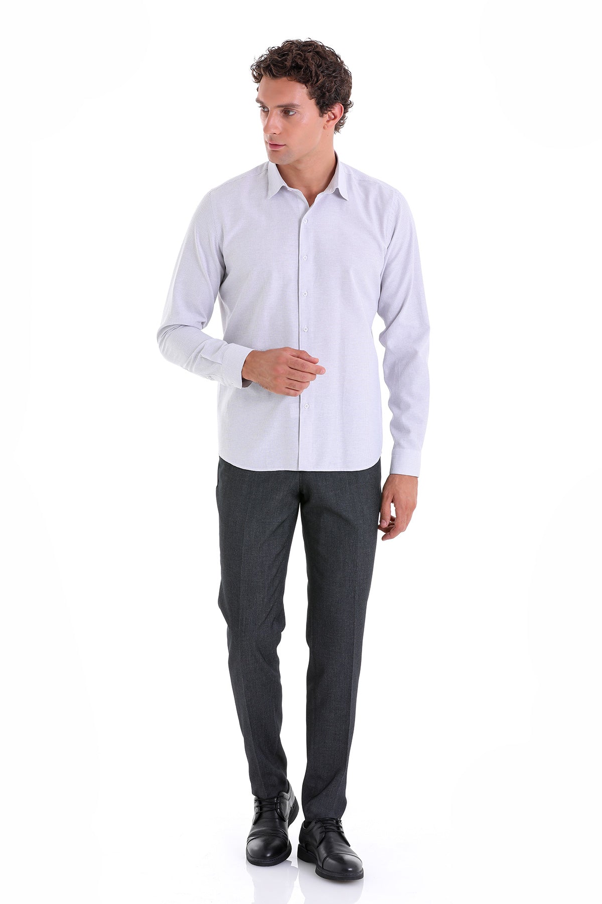 A crisp, light blue long-sleeved dress shirt with a classic collar and button-down front.