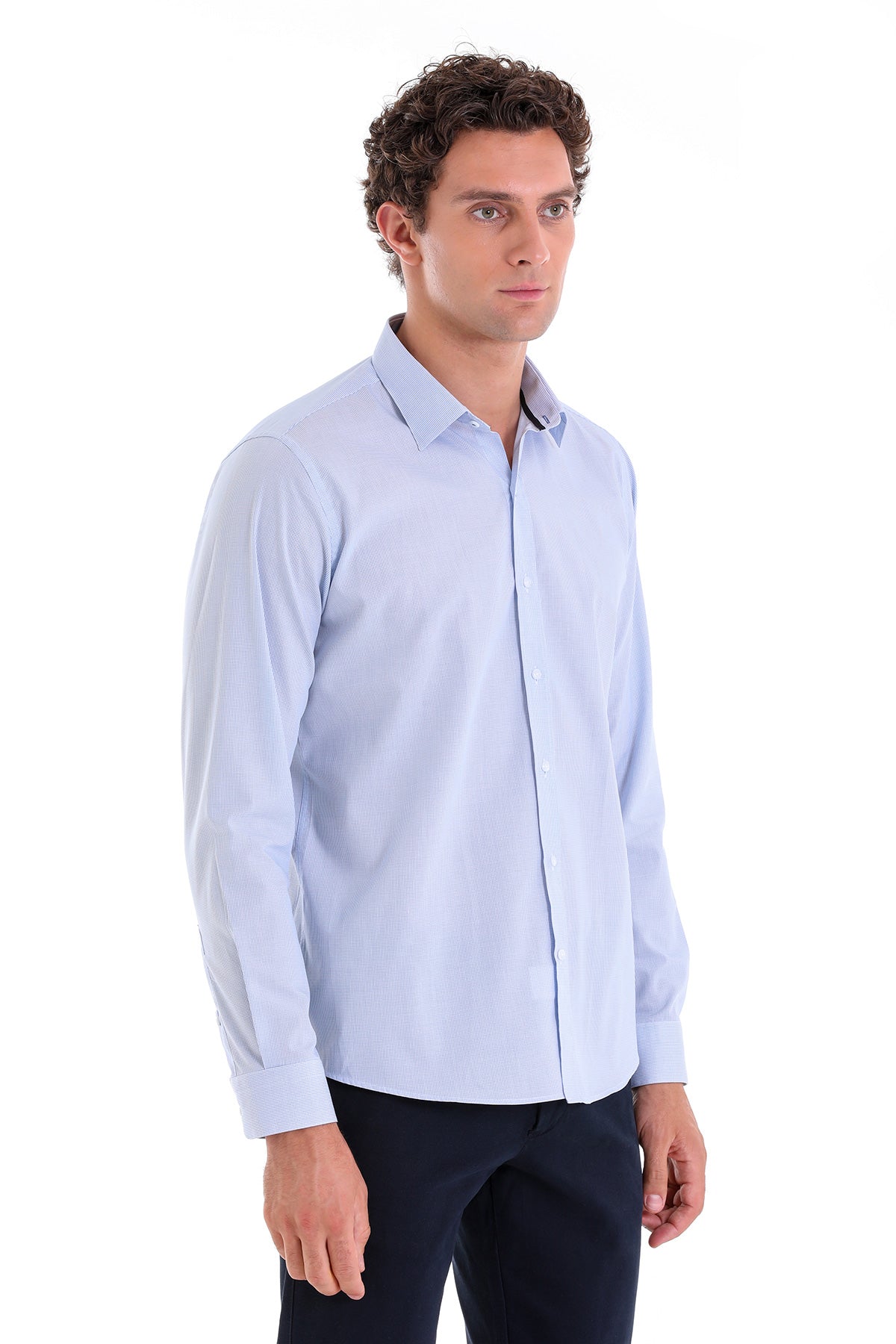 Light blue, long-sleeved men’s dress shirt with a classic collar and button-down front.