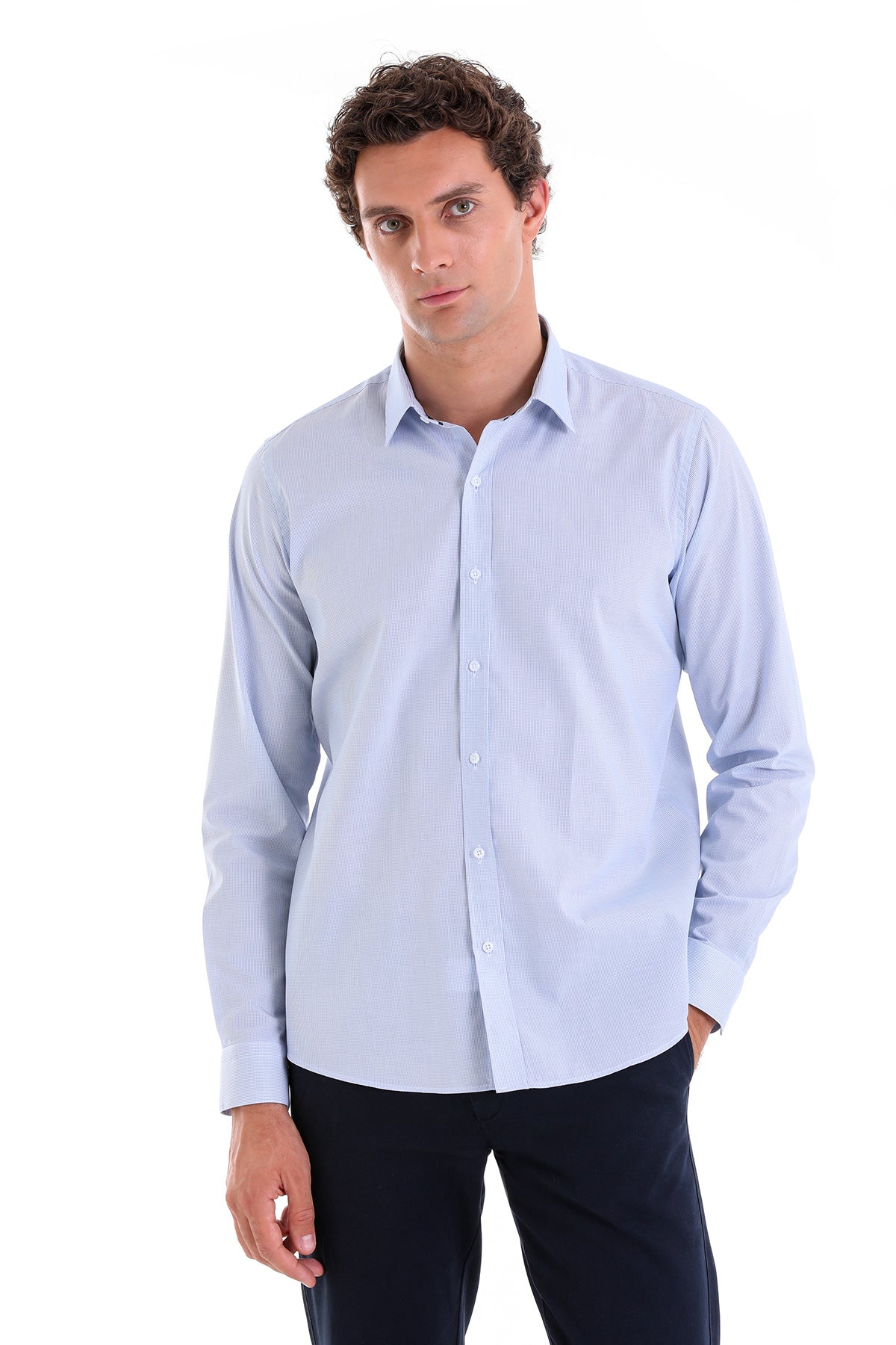 A light blue, long-sleeved men’s dress shirt with a classic collar and button-down front.