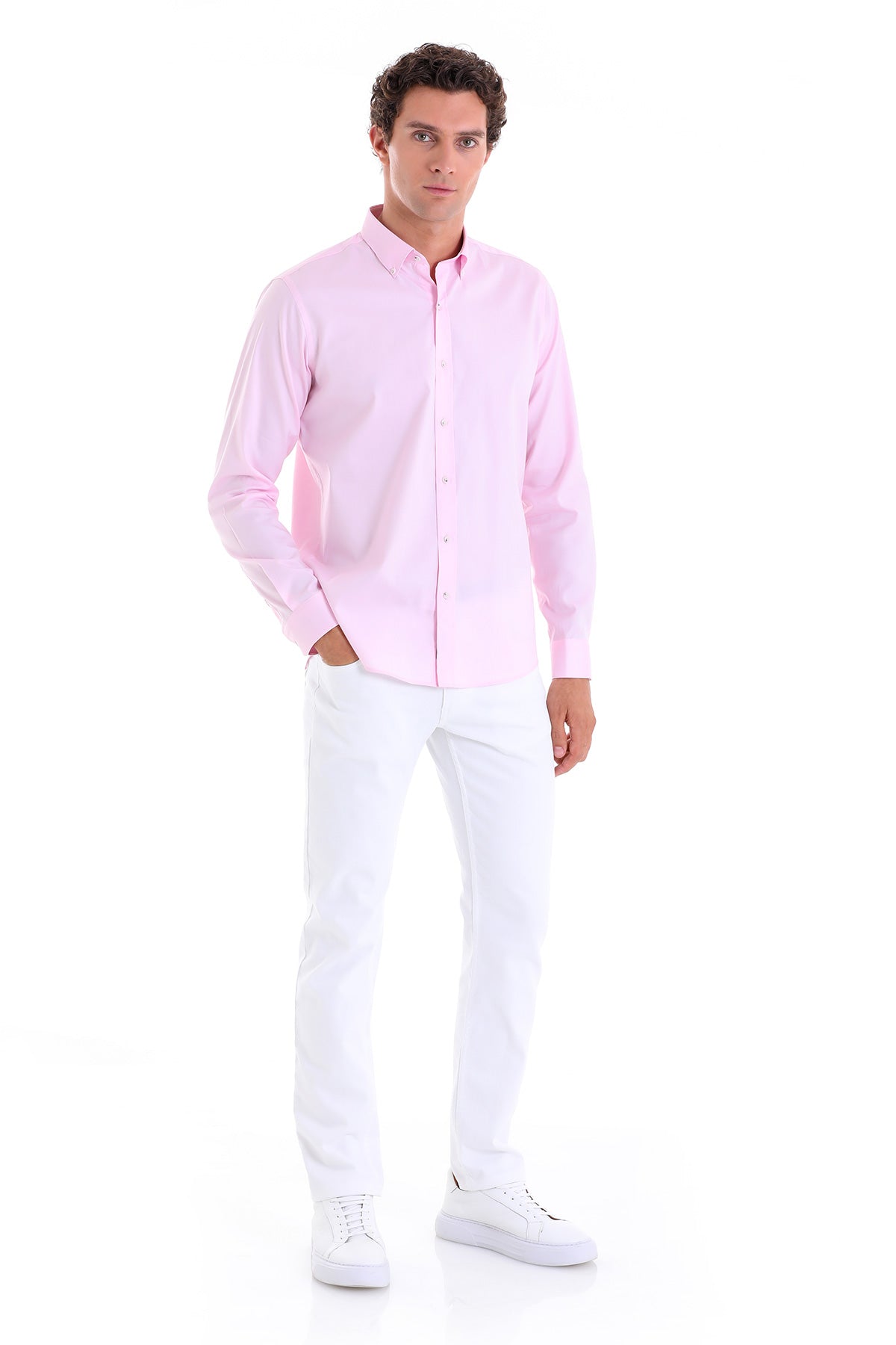 A light pink, long-sleeved button-down shirt with a classic collar and neatly pressed fabric.