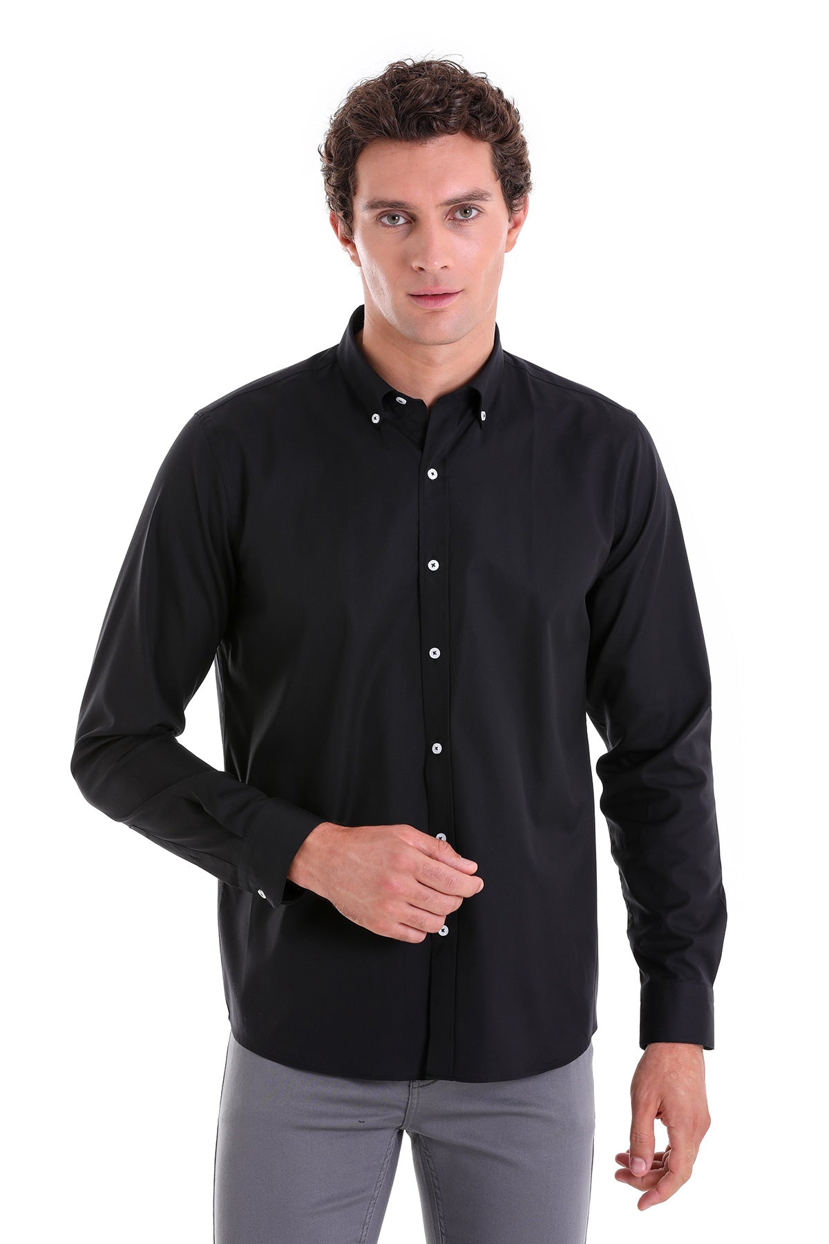 Black button-down shirt with white buttons and a classic collar.