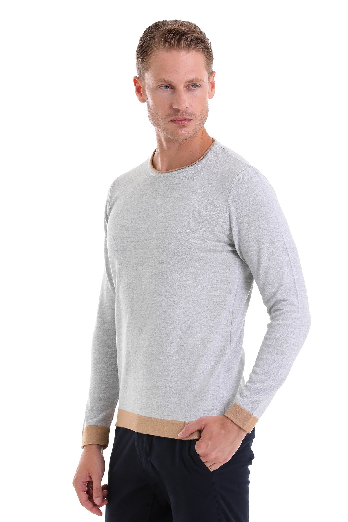 Light gray long-sleeved sweater with beige ribbed cuffs and hem.