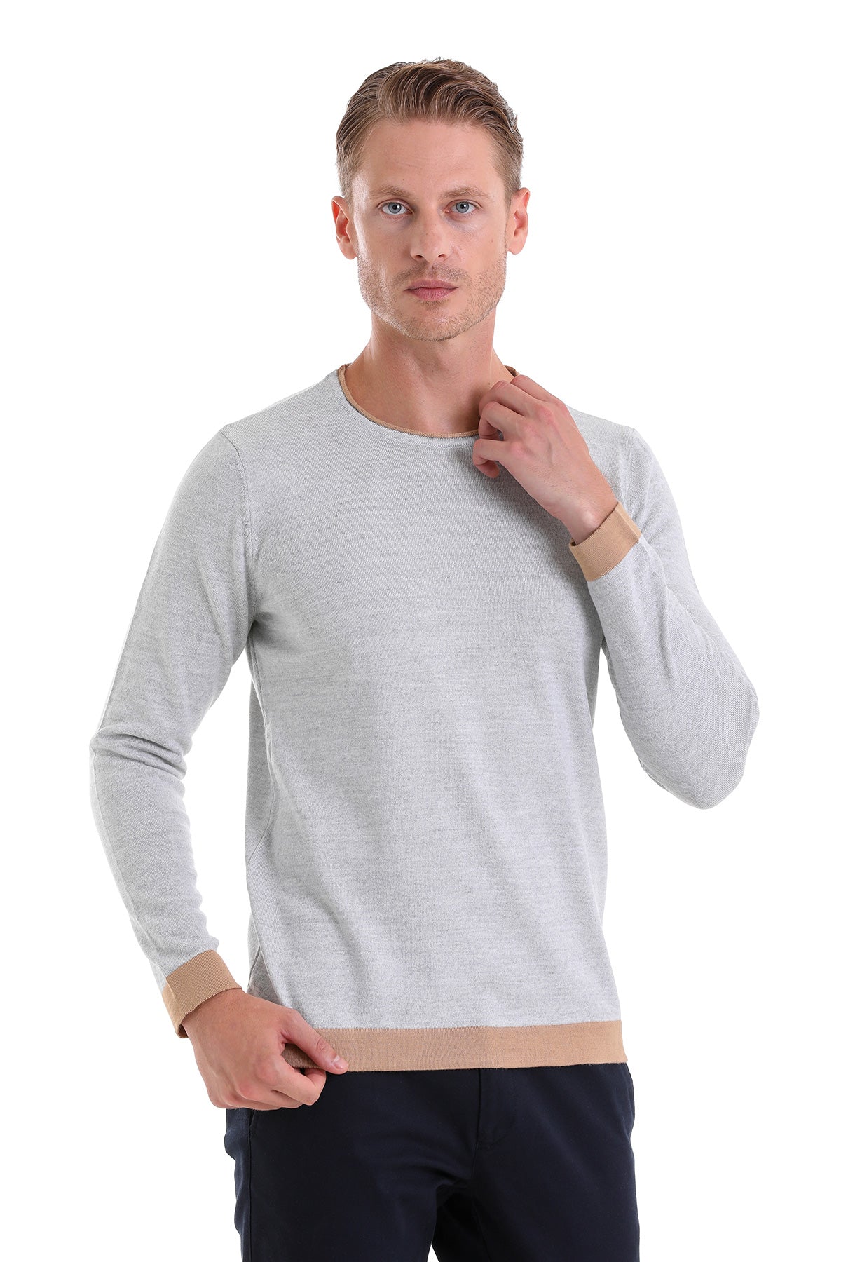Light gray long-sleeved sweater with beige ribbed cuffs and hem.