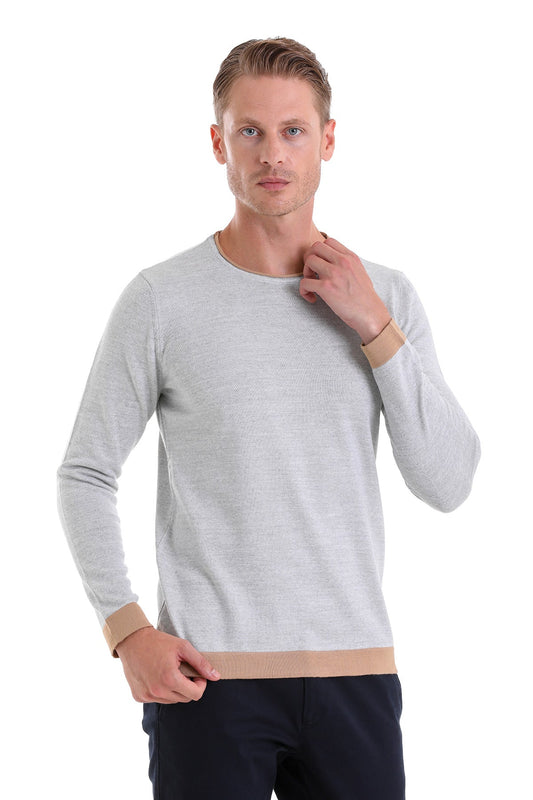Light gray long-sleeved sweater with beige ribbed cuffs and hem.
