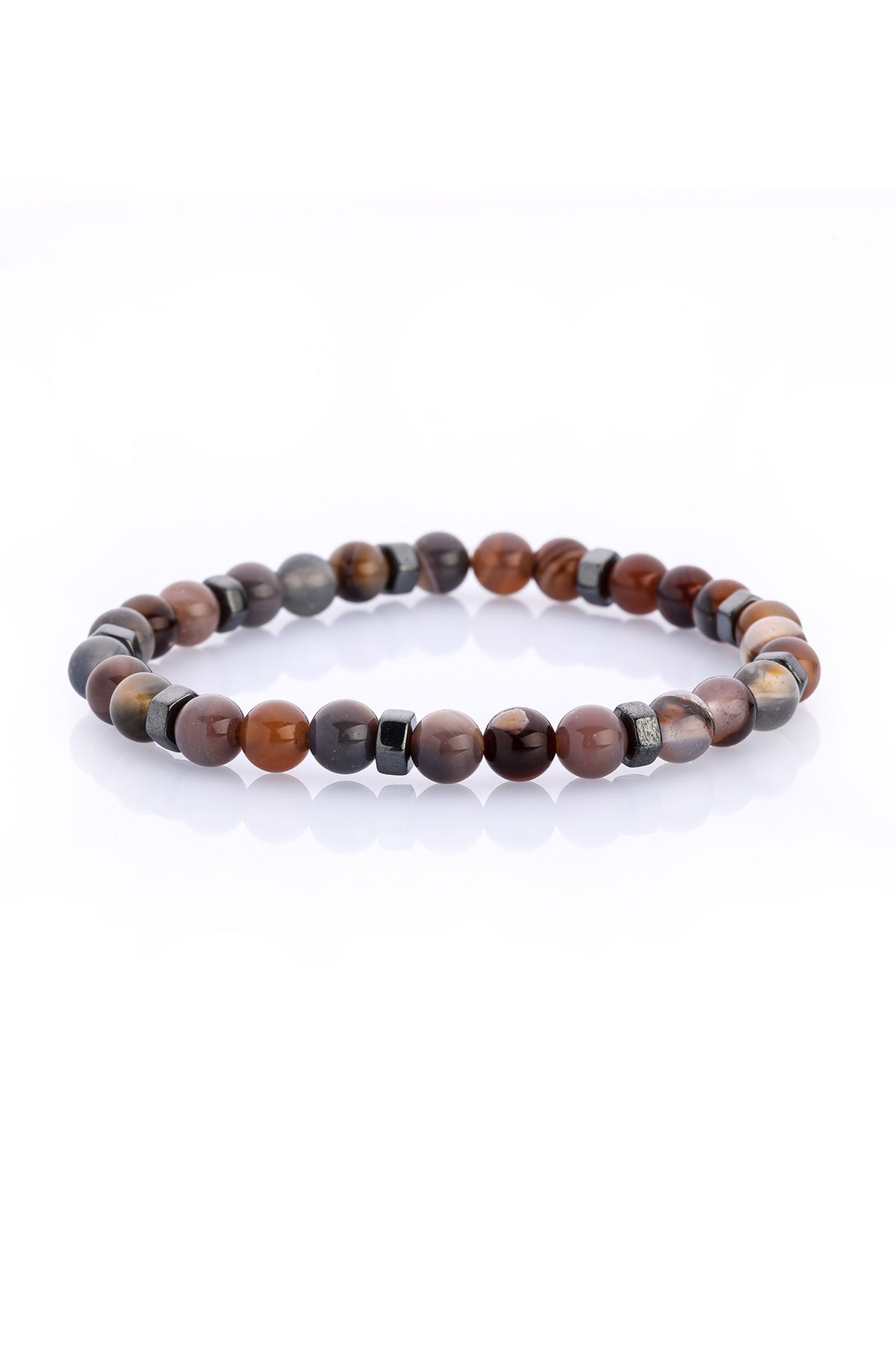 A beaded bracelet featuring alternating round tiger eye stones with warm brown and golden hues, interspersed with sleek black magnetic spacer beads.