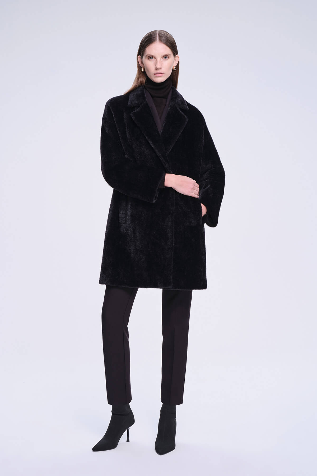 Black faux fur coat with a plush, velvety texture and classic double-breasted design.