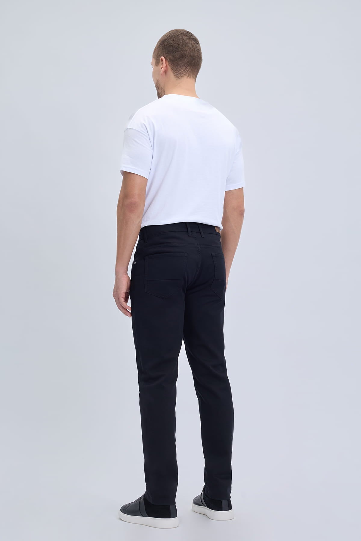 Black slim-fit dynamic fit cotton gabardine casual pants with modern cut and subtle stitching for smart casual dress
