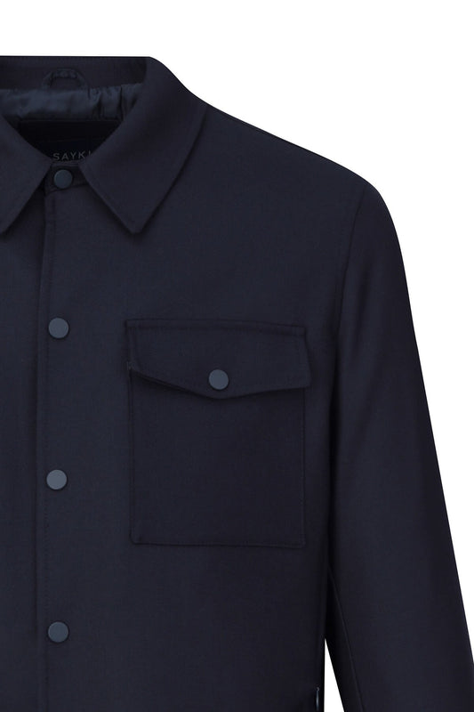 Dark navy blue button-up shirt with a classic collar and matching buttons.